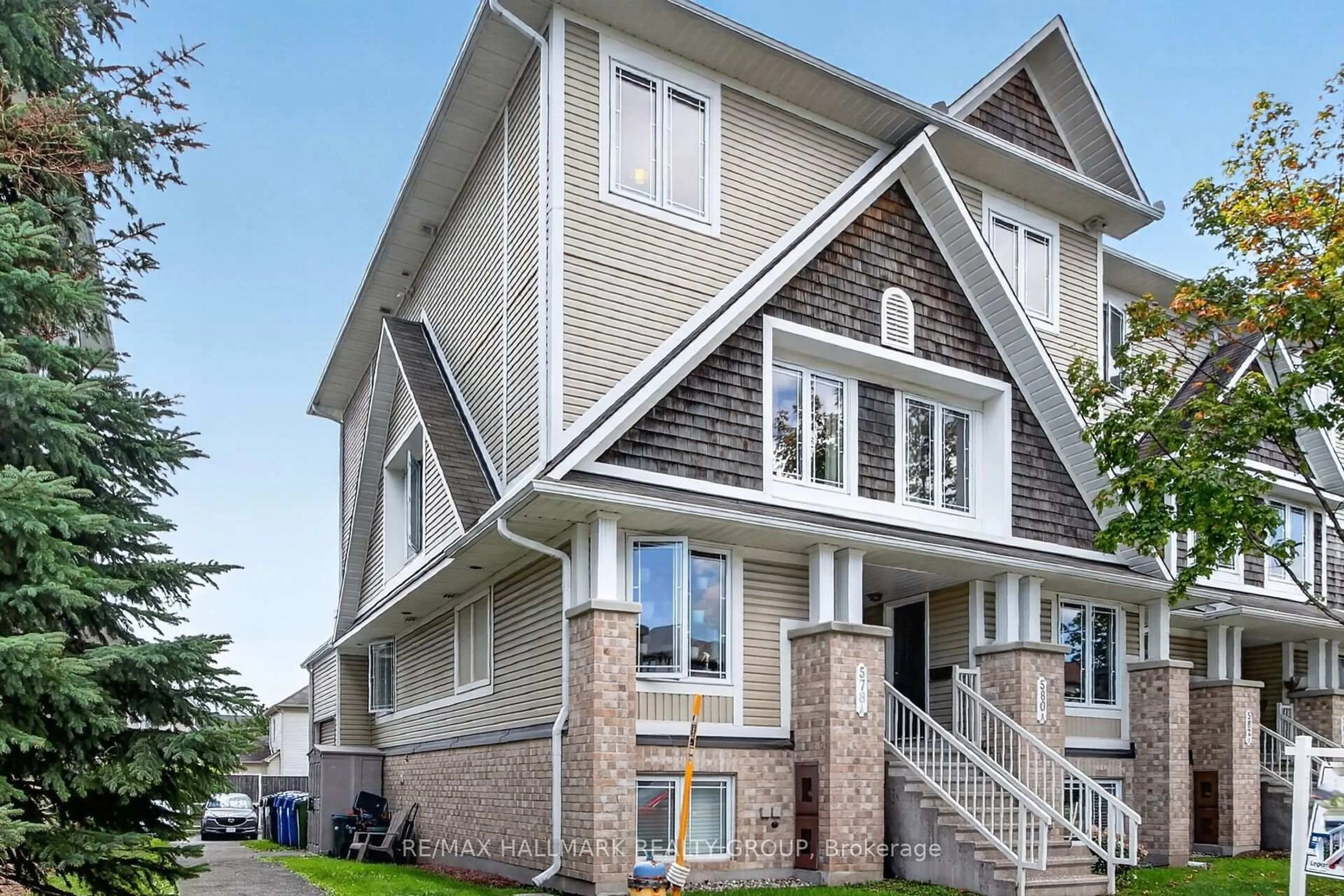Home with vinyl exterior material, street for 580A Chapman Mills Dr, Ottawa Ontario K2J 3V2