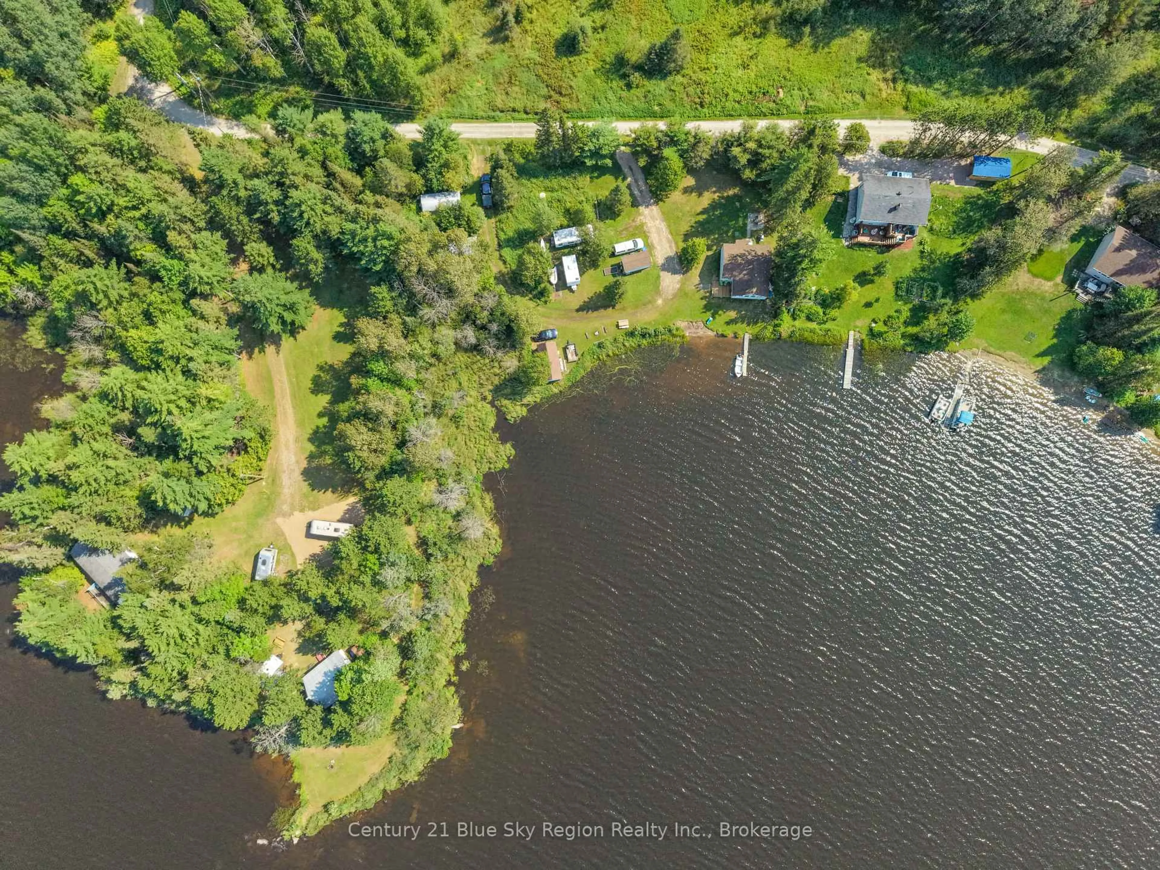 A pic from outside/outdoor area/front of a property/back of a property/a pic from drone, water/lake/river/ocean view for 86 Bayview Dr, Chisholm Ontario P0H 1Z0