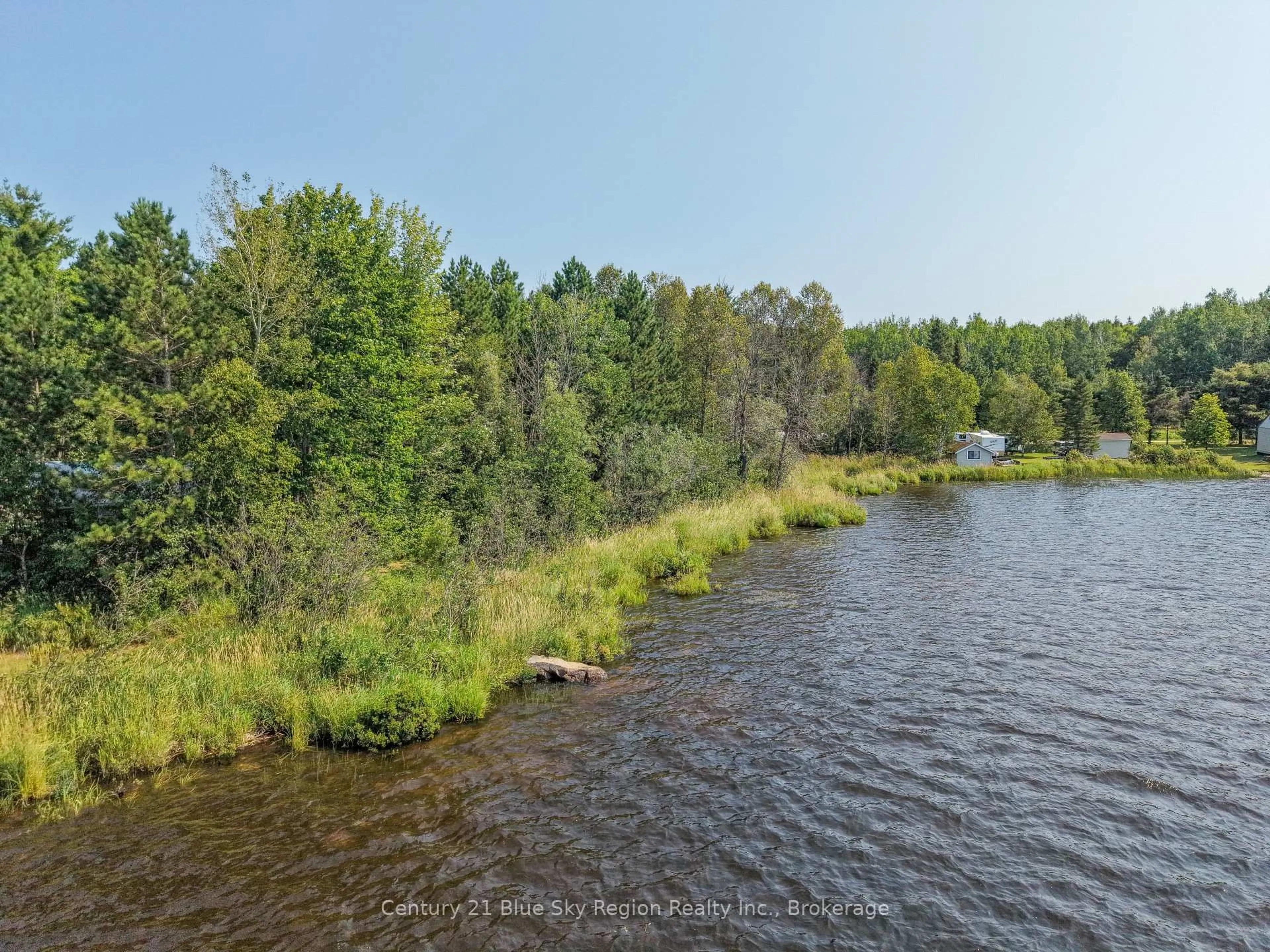 A pic from outside/outdoor area/front of a property/back of a property/a pic from drone, water/lake/river/ocean view for 86 Bayview Dr, Chisholm Ontario P0H 1Z0