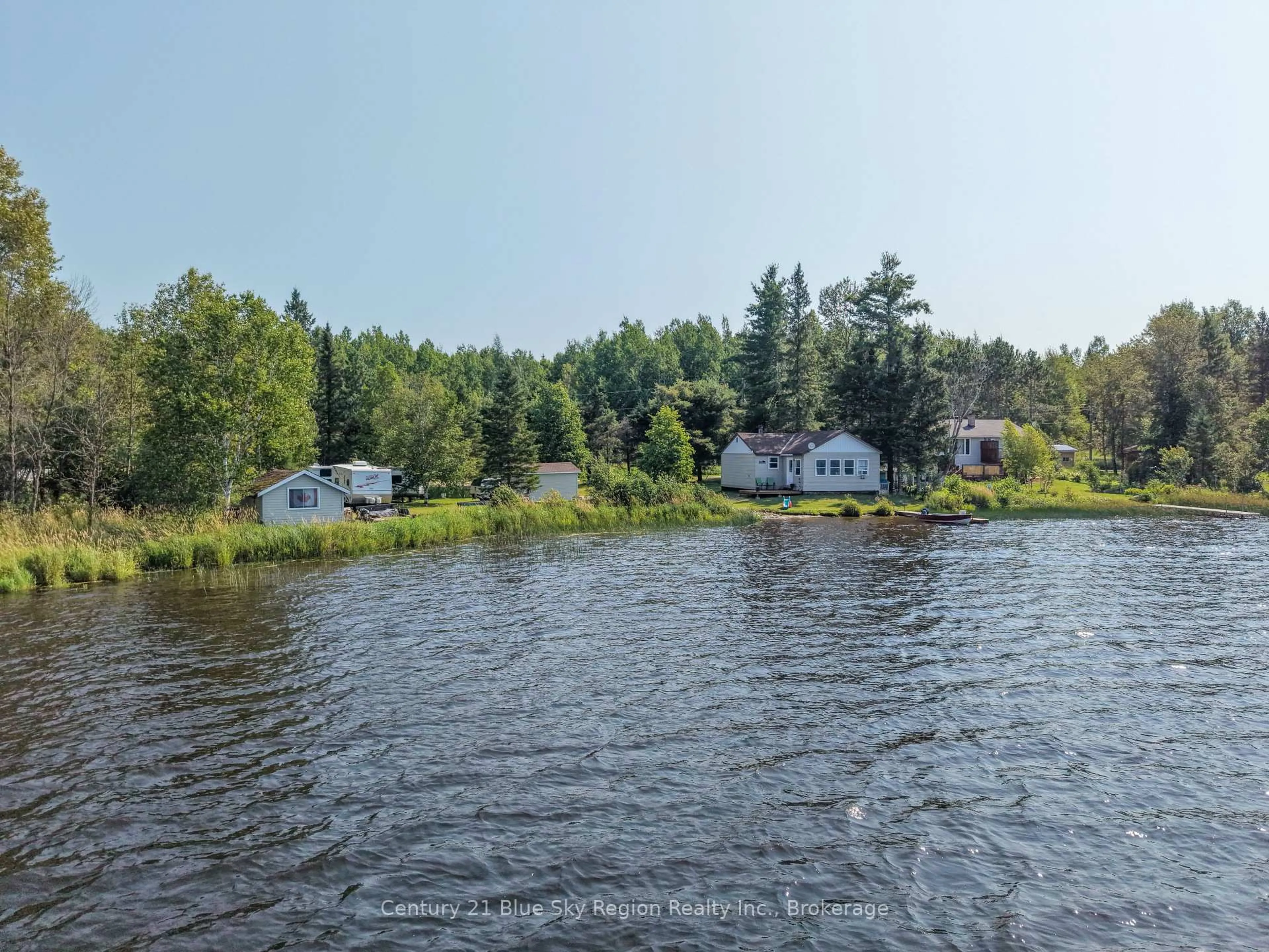 A pic from outside/outdoor area/front of a property/back of a property/a pic from drone, water/lake/river/ocean view for 86 Bayview Dr, Chisholm Ontario P0H 1Z0