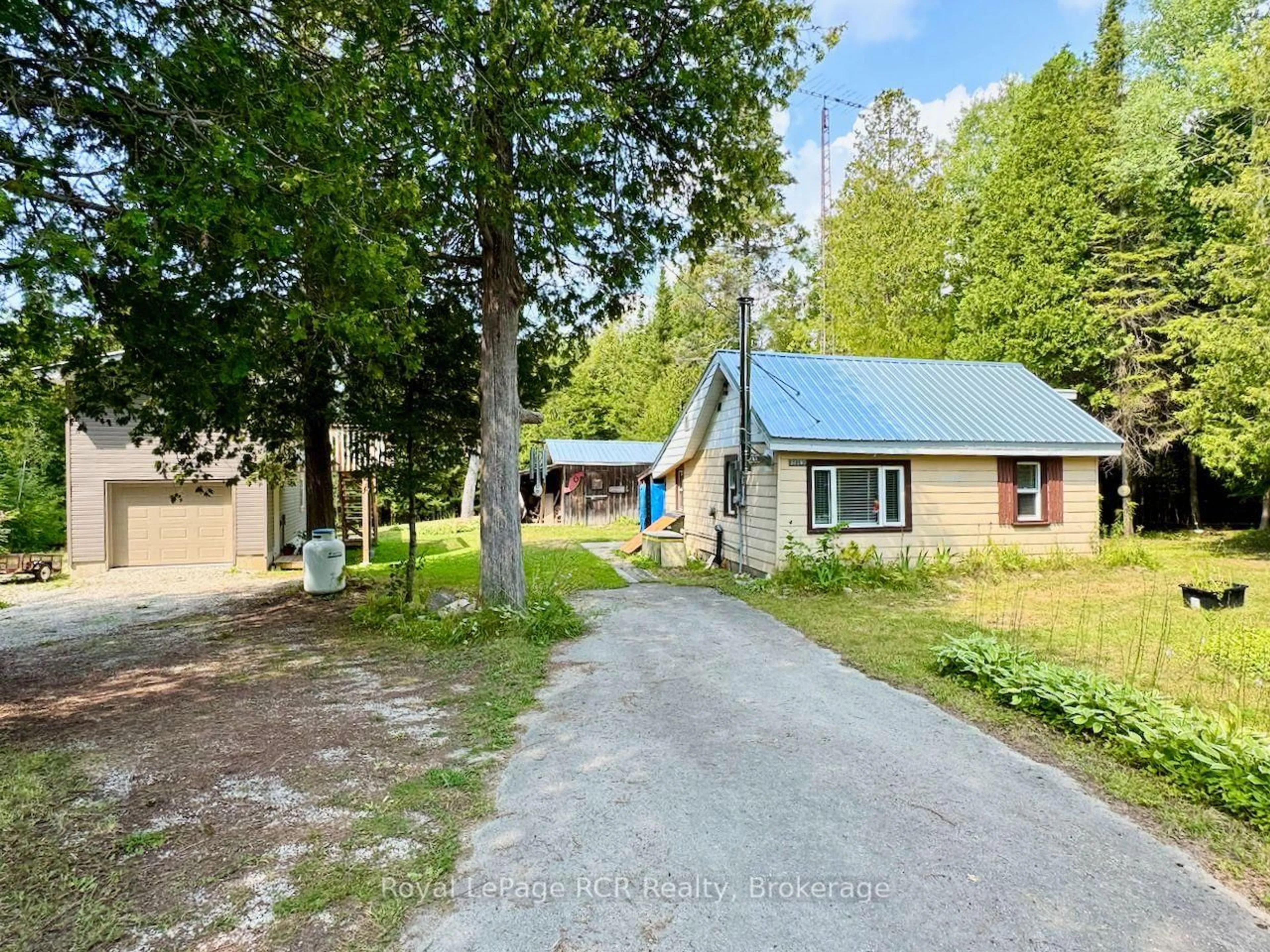 A pic from outside/outdoor area/front of a property/back of a property/a pic from drone, street for 568 Stokes Bay Rd, Northern Bruce Peninsula Ontario N0H 1W0