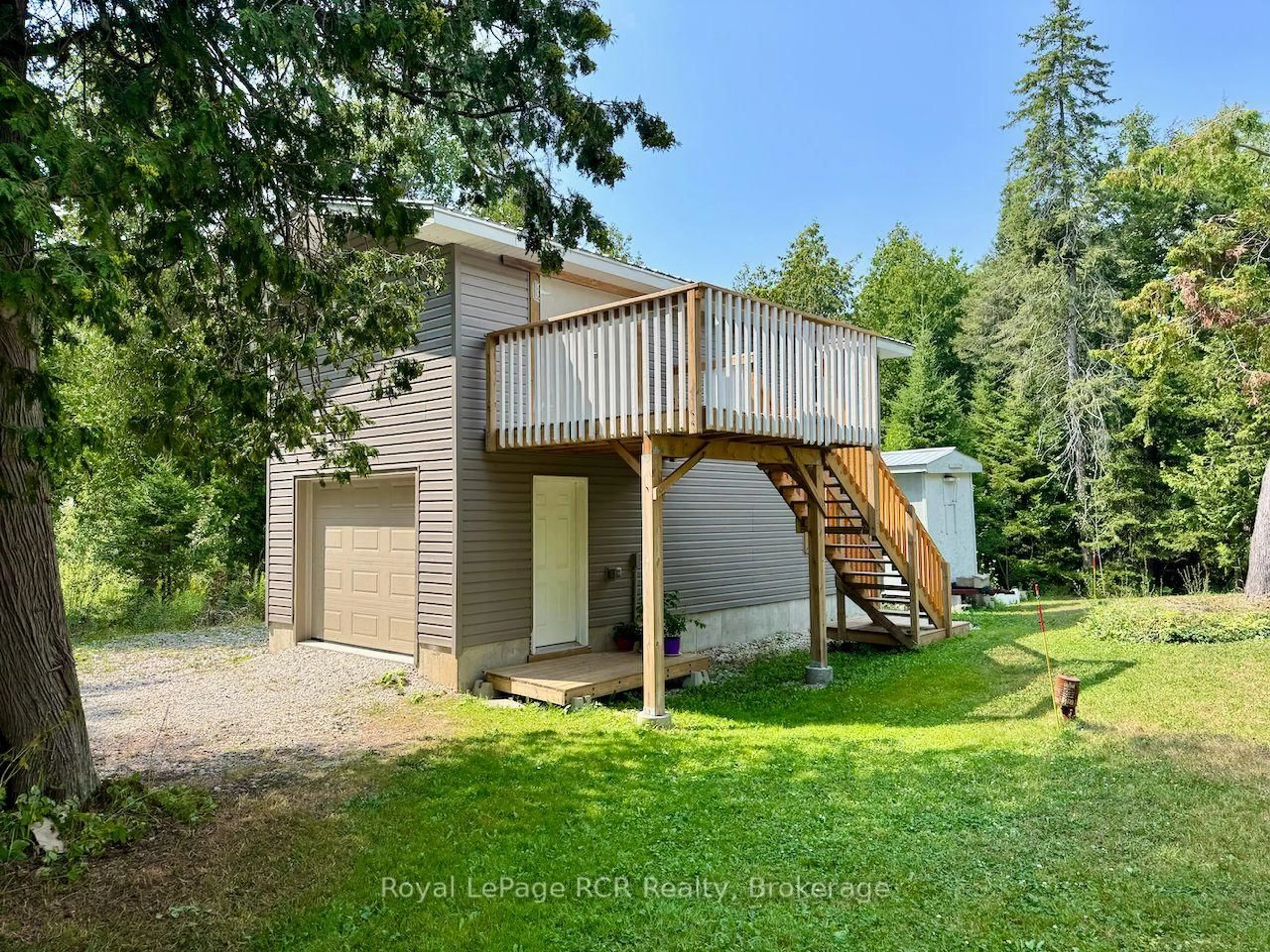 A pic from outside/outdoor area/front of a property/back of a property/a pic from drone, forest/trees view for 568 Stokes Bay Rd, Northern Bruce Peninsula Ontario N0H 1W0