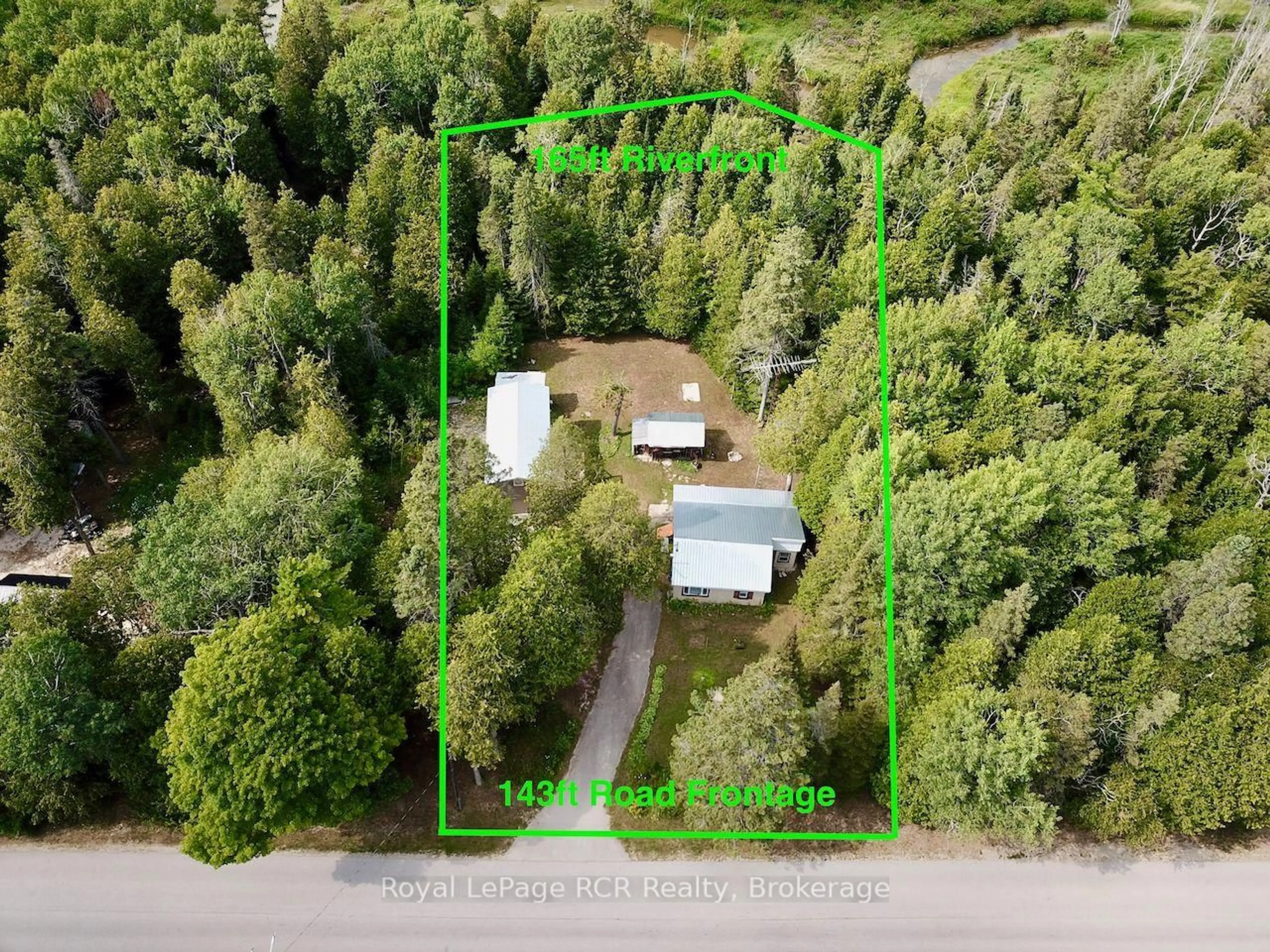 A pic from outside/outdoor area/front of a property/back of a property/a pic from drone, forest/trees view for 568 Stokes Bay Rd, Northern Bruce Peninsula Ontario N0H 1W0