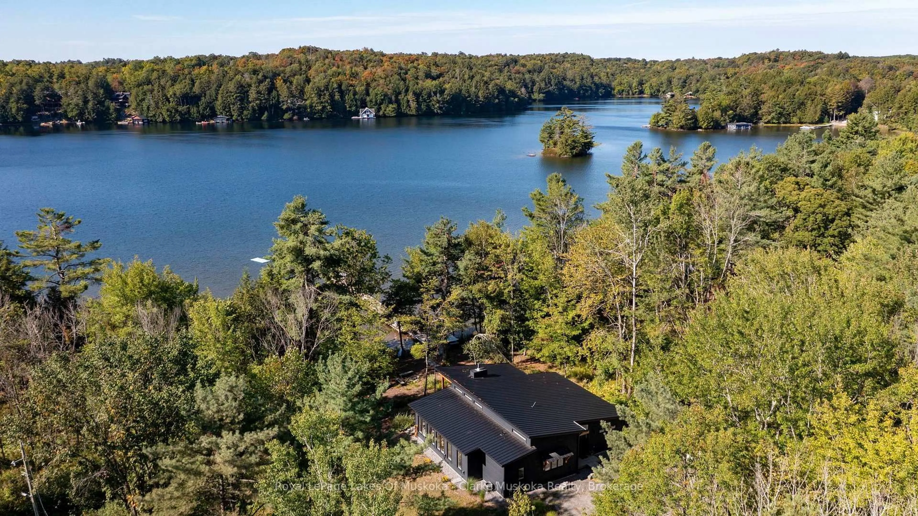 A pic from outside/outdoor area/front of a property/back of a property/a pic from drone, water/lake/river/ocean view for 56 Blair Point Rd, Seguin Ontario P0C 1J0