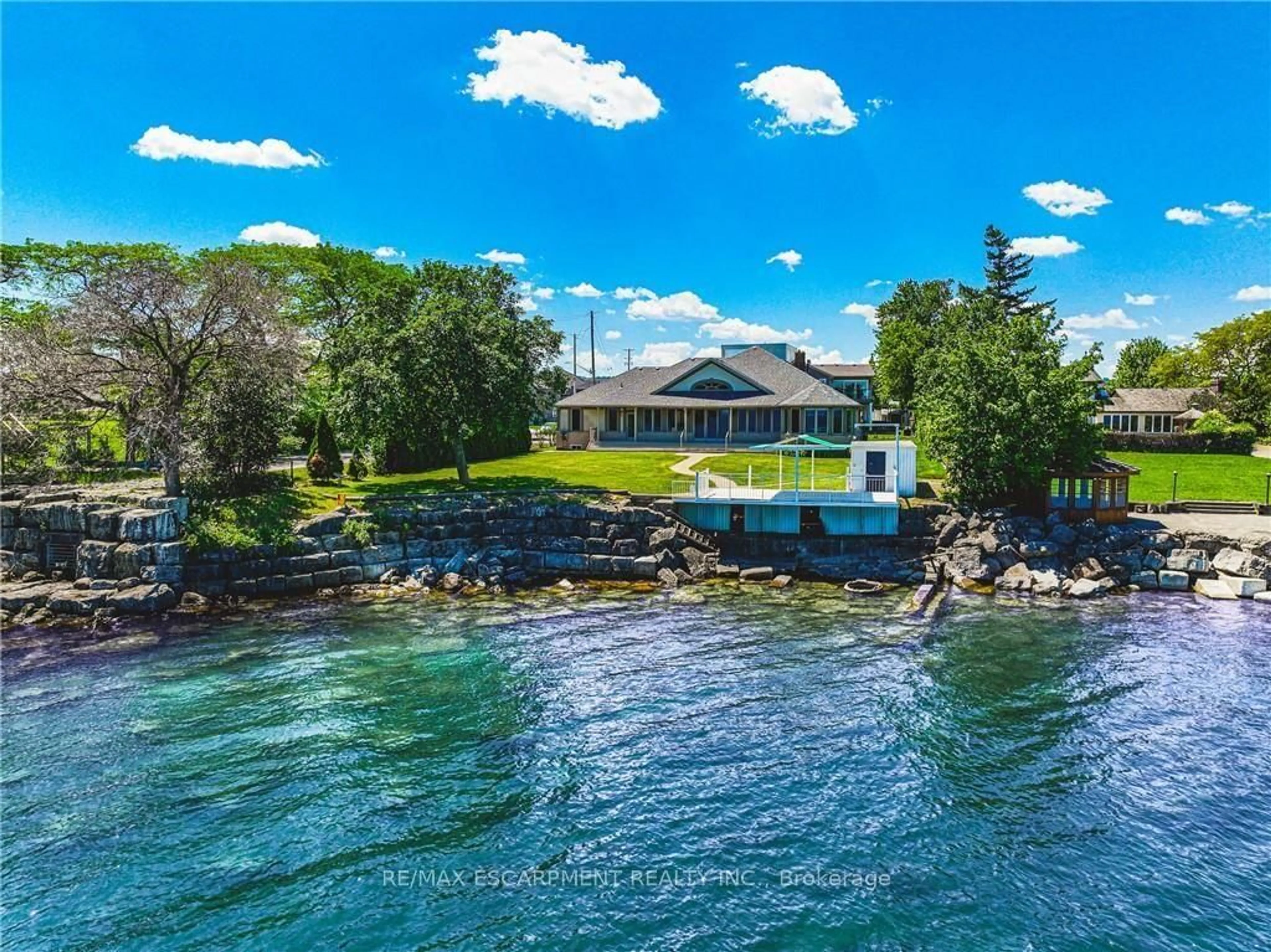 A pic from outside/outdoor area/front of a property/back of a property/a pic from drone, water/lake/river/ocean view for 511 Glover Rd, Hamilton Ontario L8E 5C6