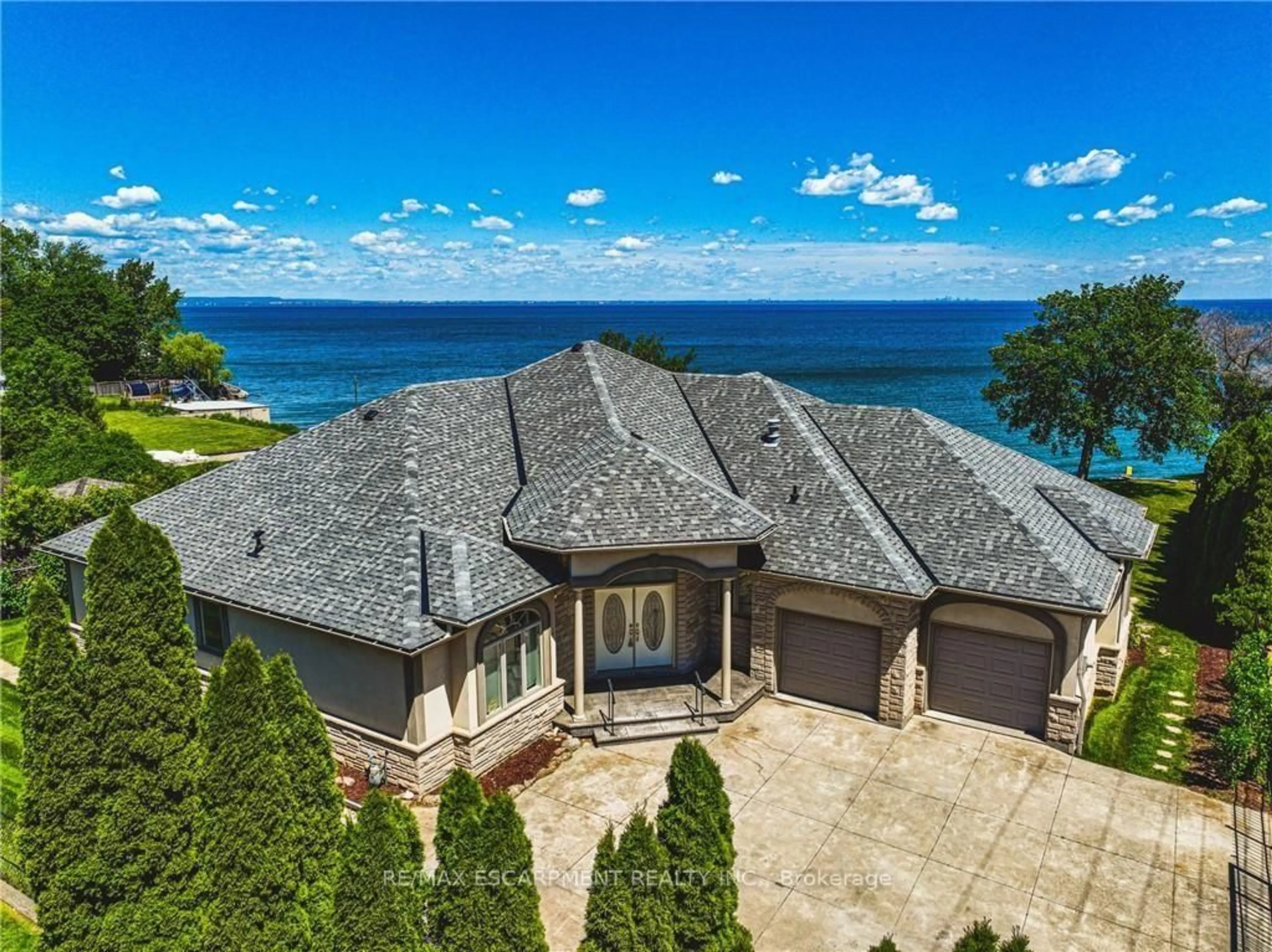 A pic from outside/outdoor area/front of a property/back of a property/a pic from drone, water/lake/river/ocean view for 511 Glover Rd, Hamilton Ontario L8E 5C6
