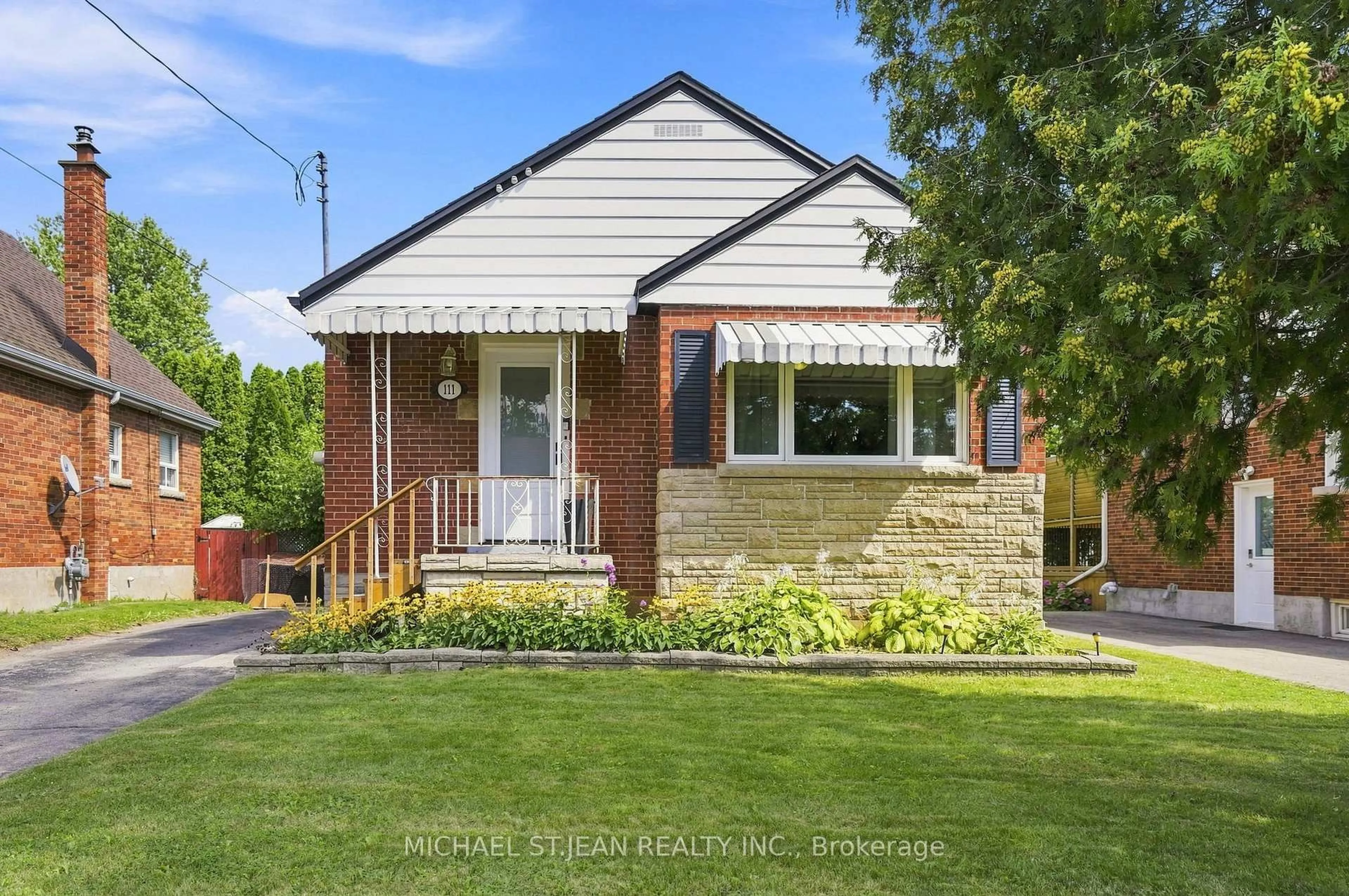 Home with brick exterior material, street for 111 Sharon Ave, Hamilton Ontario L8T 1E4
