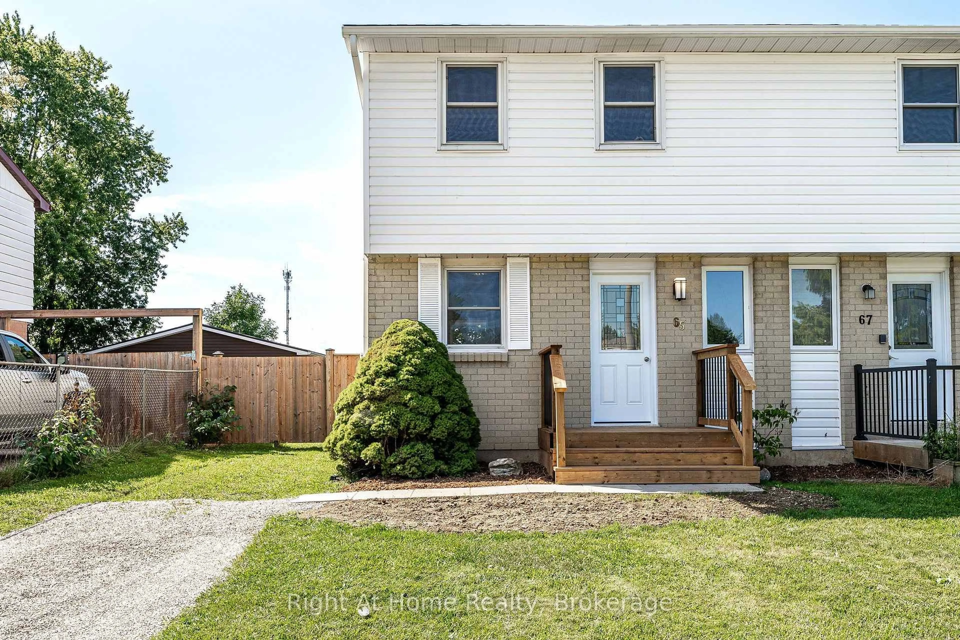 Home with vinyl exterior material, street for 65 Maple Ave, Stratford Ontario N5A 7C3