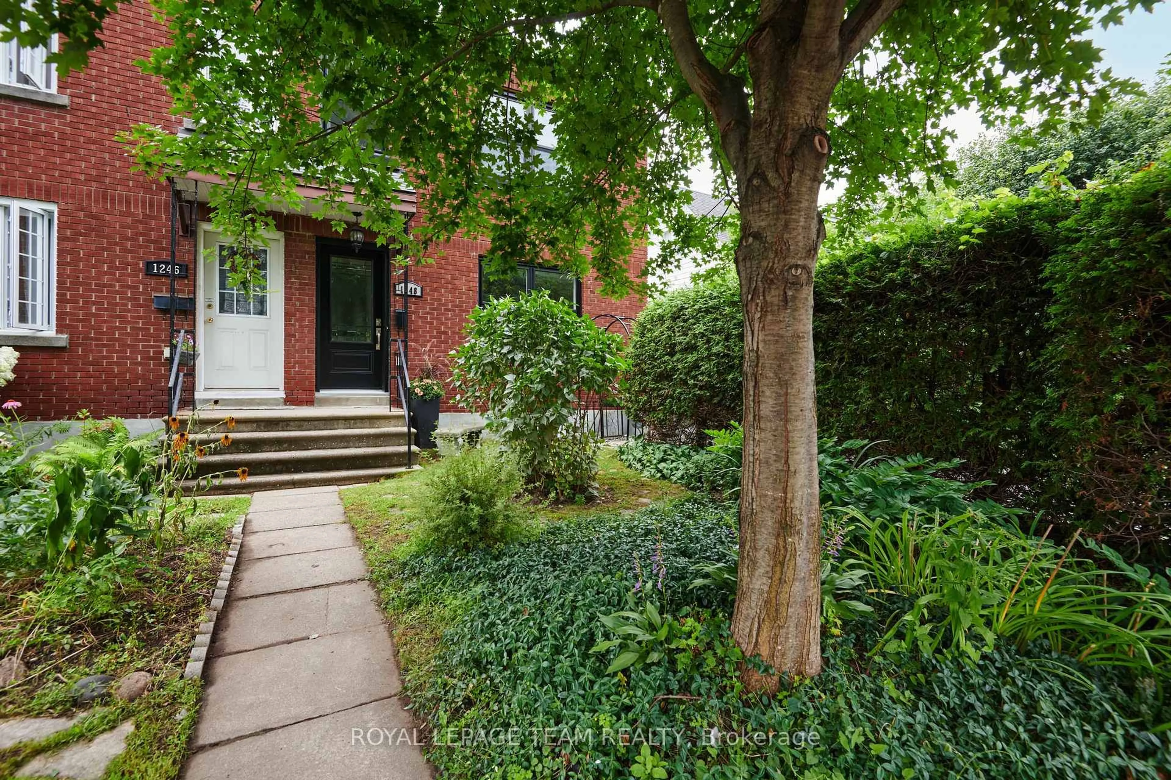 Home with brick exterior material, street for 1248 Summerville Ave, Ottawa Ontario K1Z 8G5