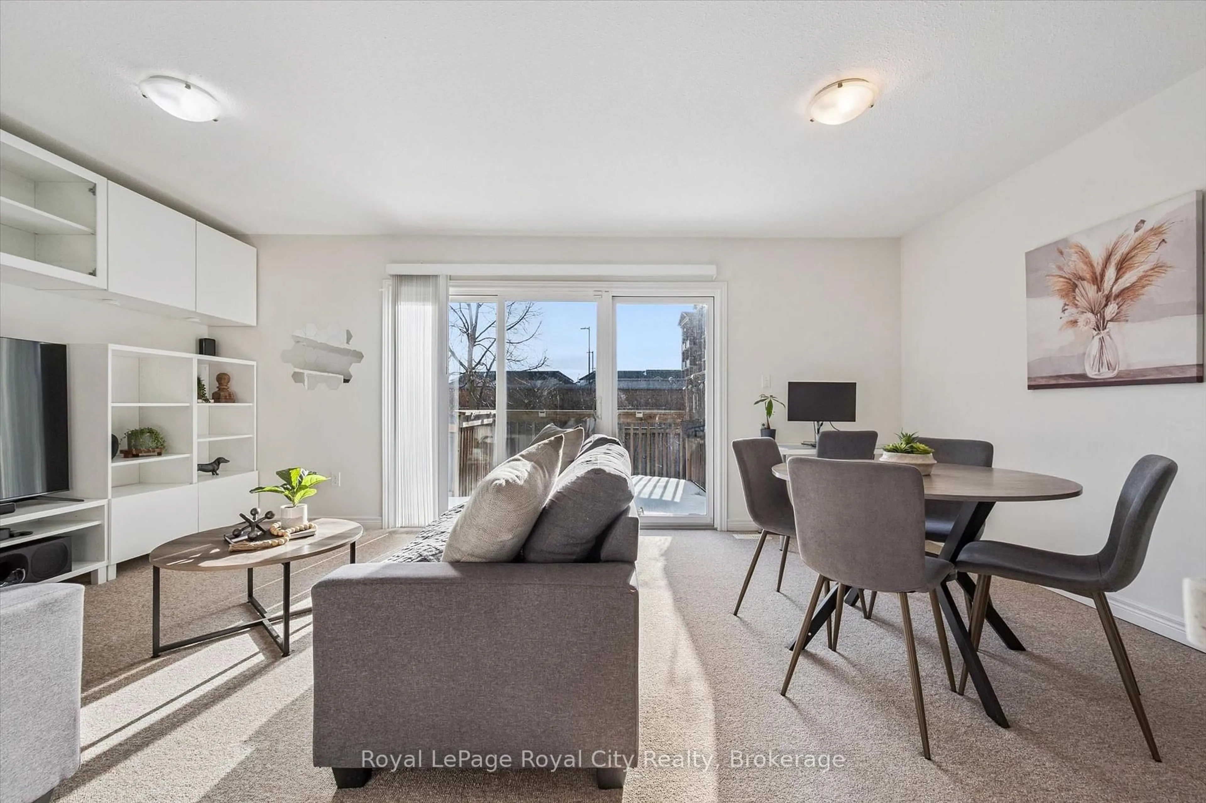 Living room with furniture, wood/laminate floor for 361 Arkell Rd #6, Guelph Ontario N1L 1E5