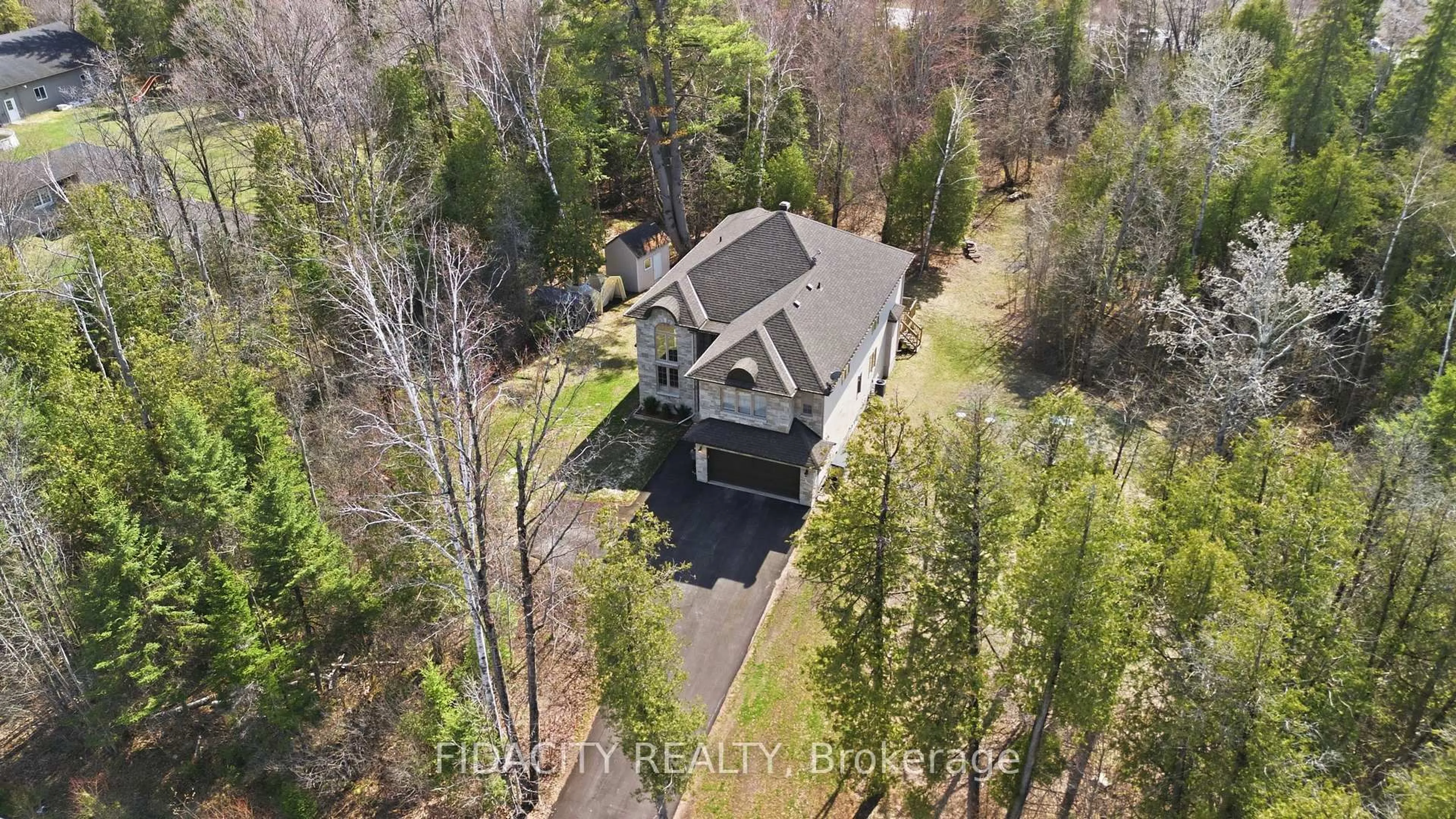A pic from outside/outdoor area/front of a property/back of a property/a pic from drone, forest/trees view for 152 Wilbert Cox Dr, Carp Ontario K0A 1L0