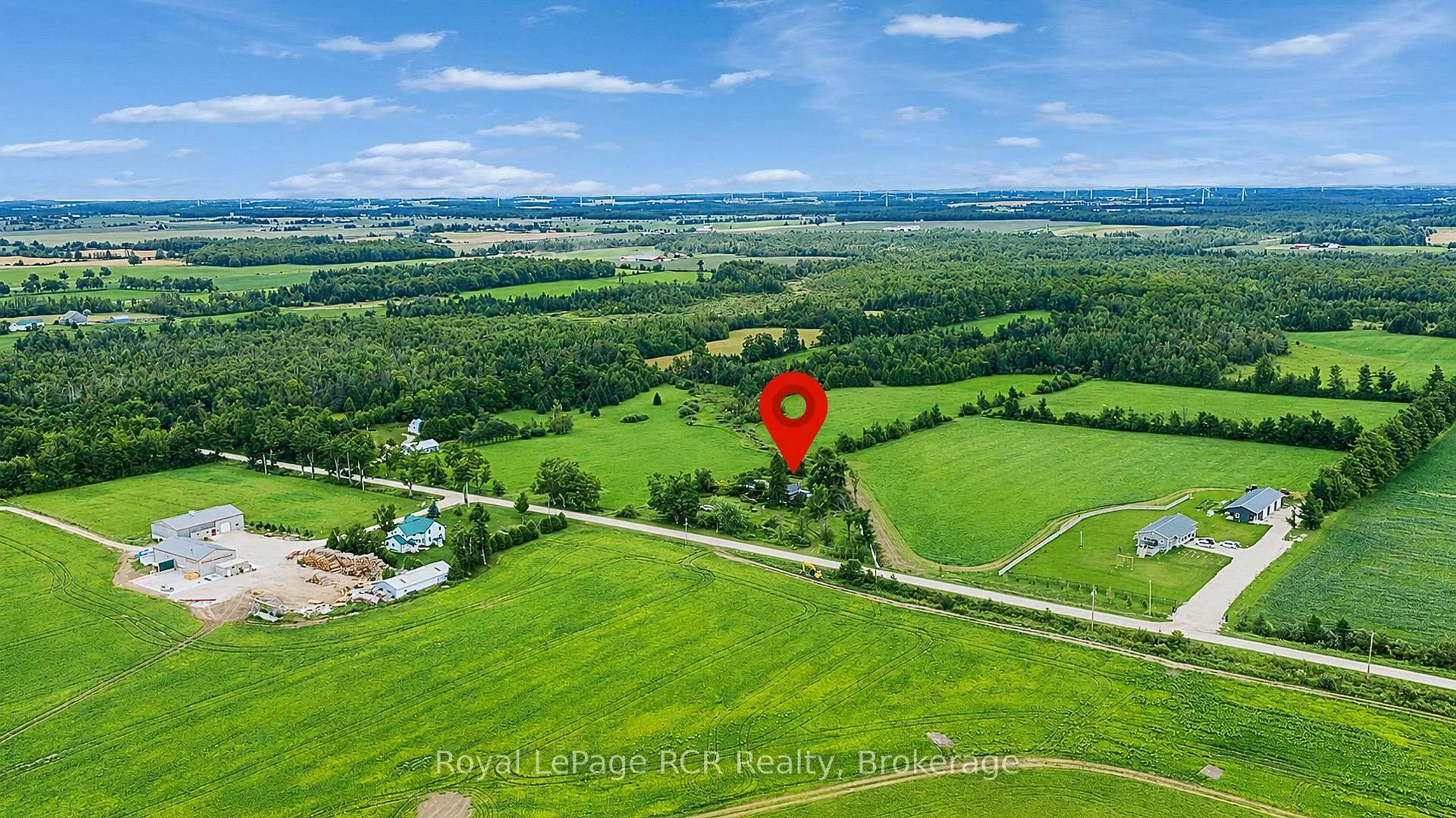 A pic from outside/outdoor area/front of a property/back of a property/a pic from drone, water/lake/river/ocean view for 309158 Centre Line B, Grey Highlands Ontario N0C 1A0