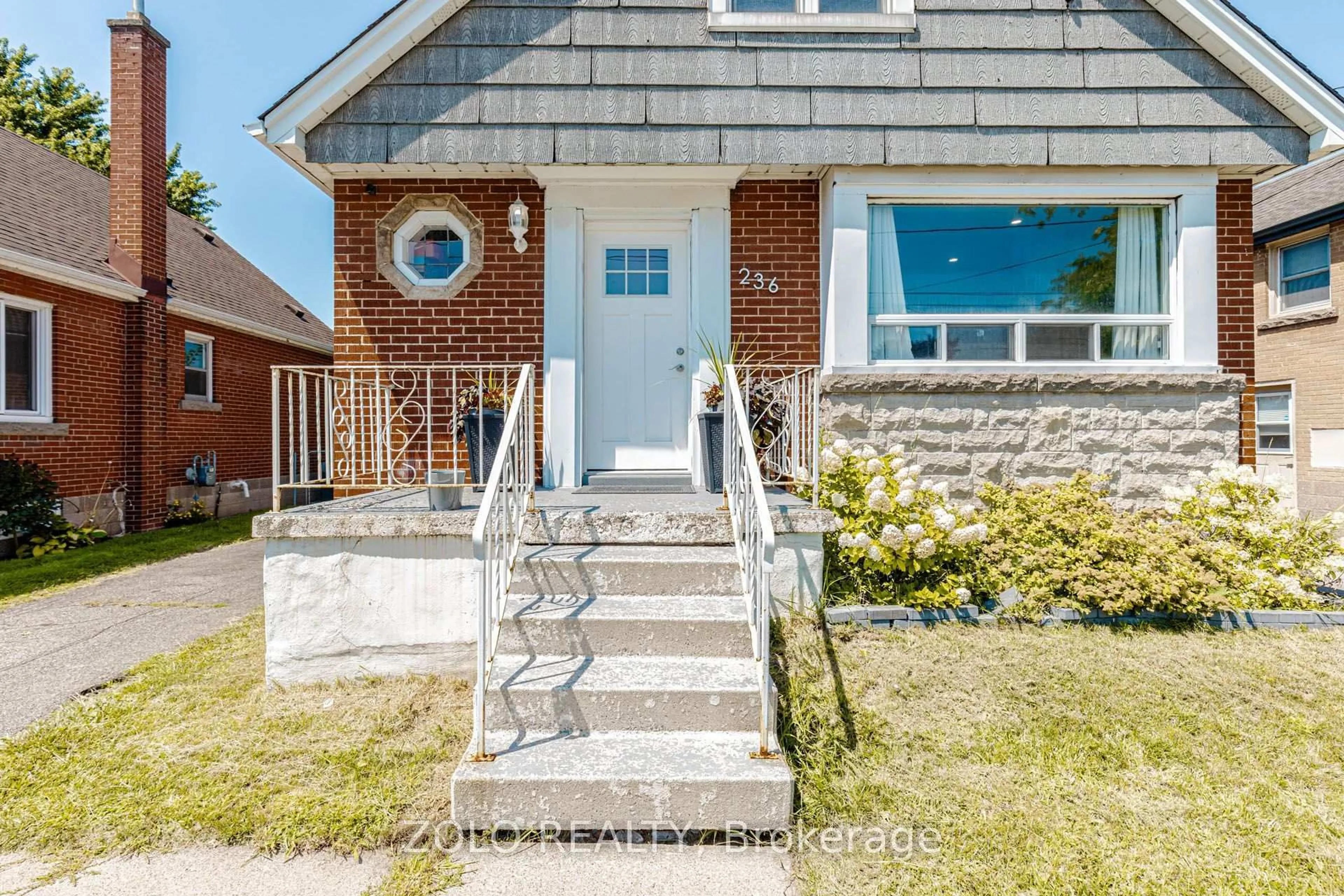 Home with brick exterior material, street for 236 Parkdale Ave, Hamilton Ontario L8K 3P6