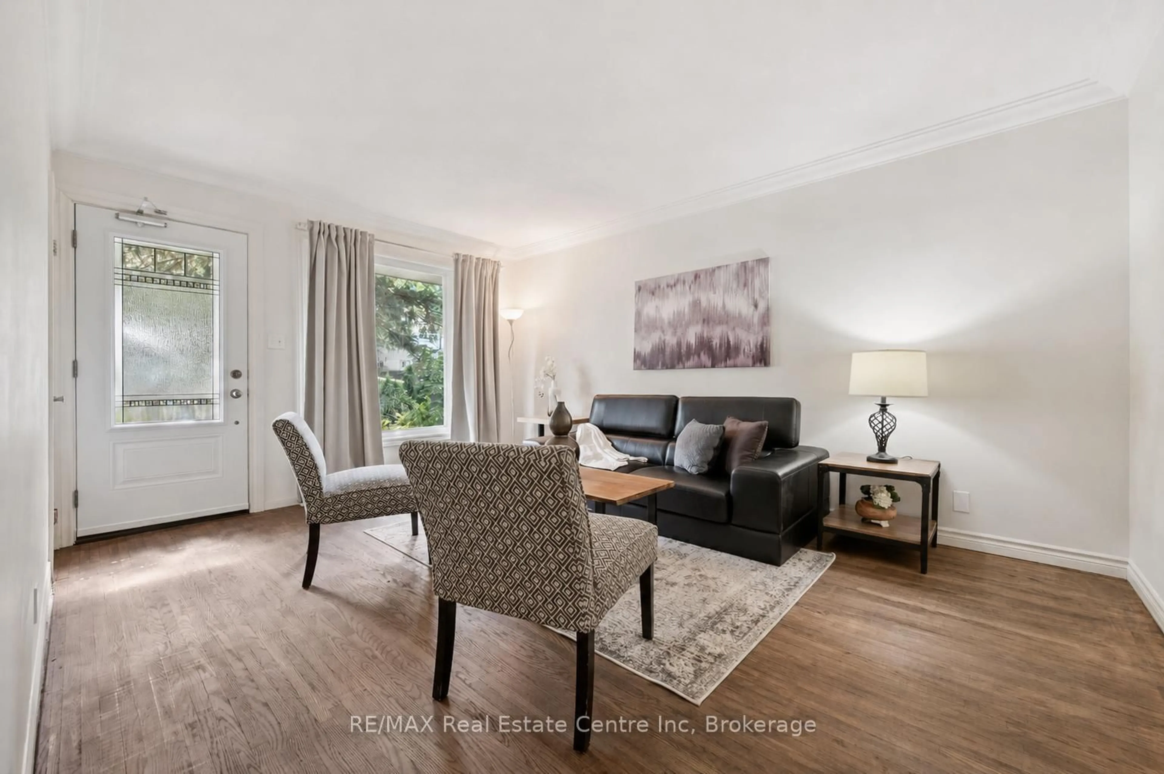 Living room with furniture, wood/laminate floor for 277 KATHLEEN St, Guelph Ontario N1H 4Y7