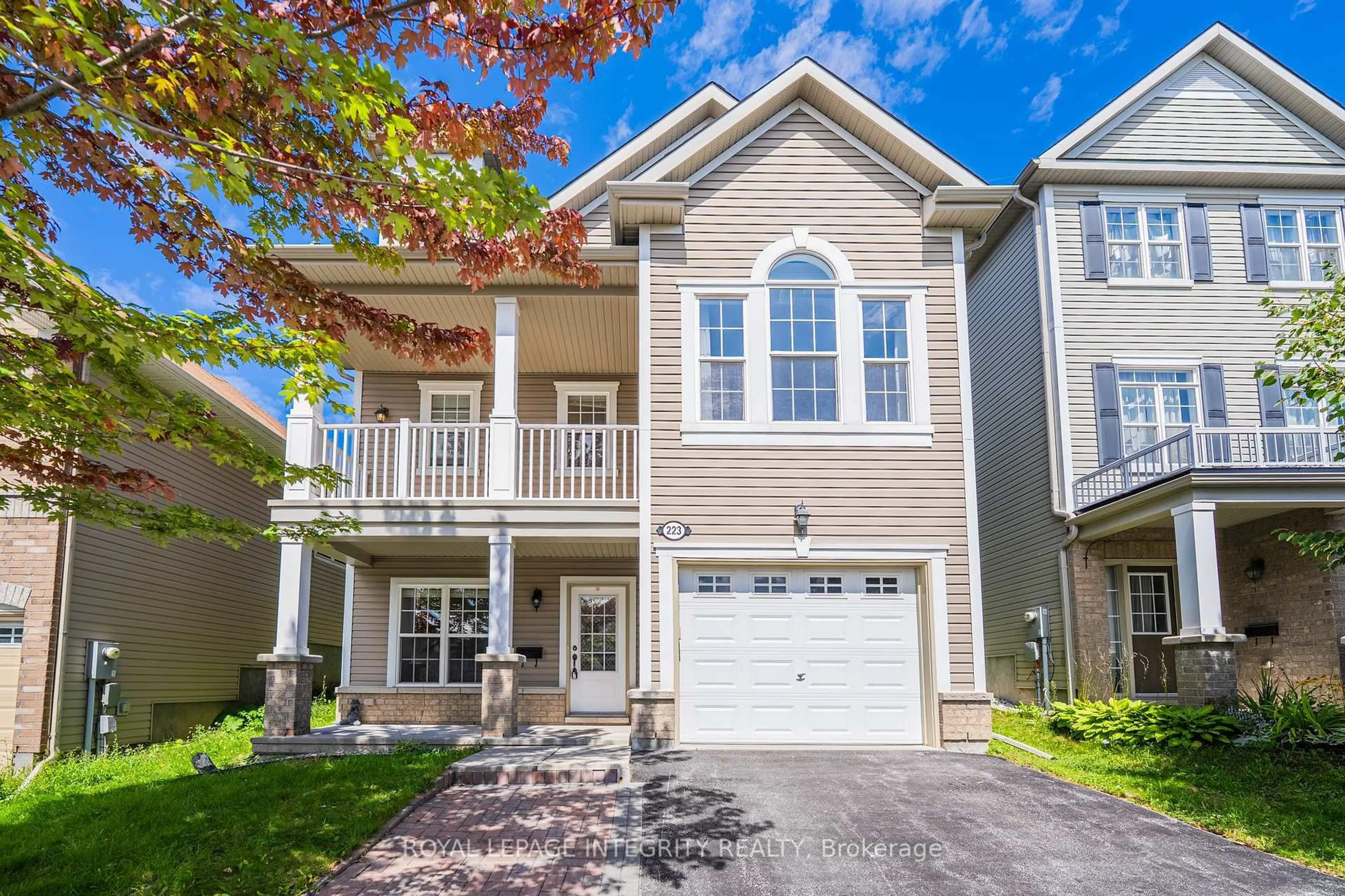 Home with vinyl exterior material, street for 223 HUNTSVILLE Dr, Ottawa Ontario K2T 0C7