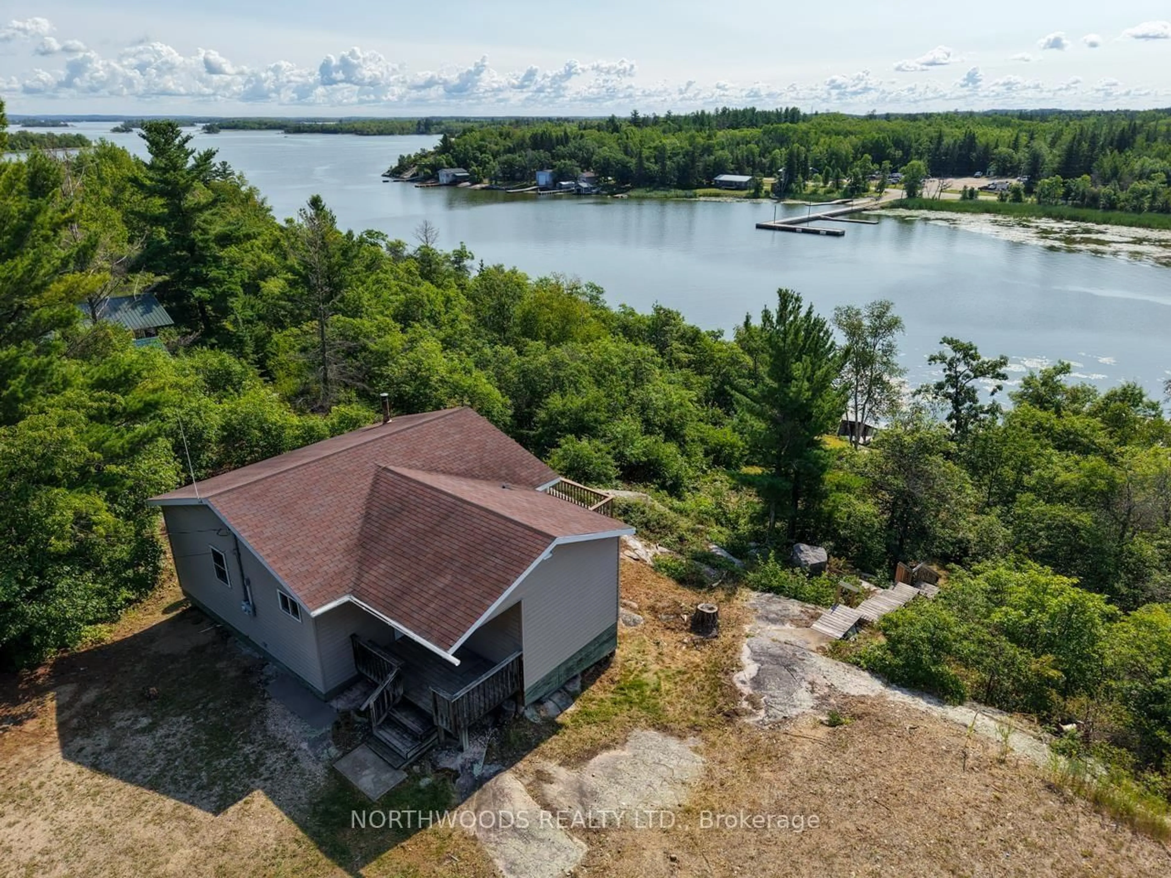 A pic from outside/outdoor area/front of a property/back of a property/a pic from drone, water/lake/river/ocean view for 302 Ottilie Road, Lake of the Woods Ontario P0W 1J0
