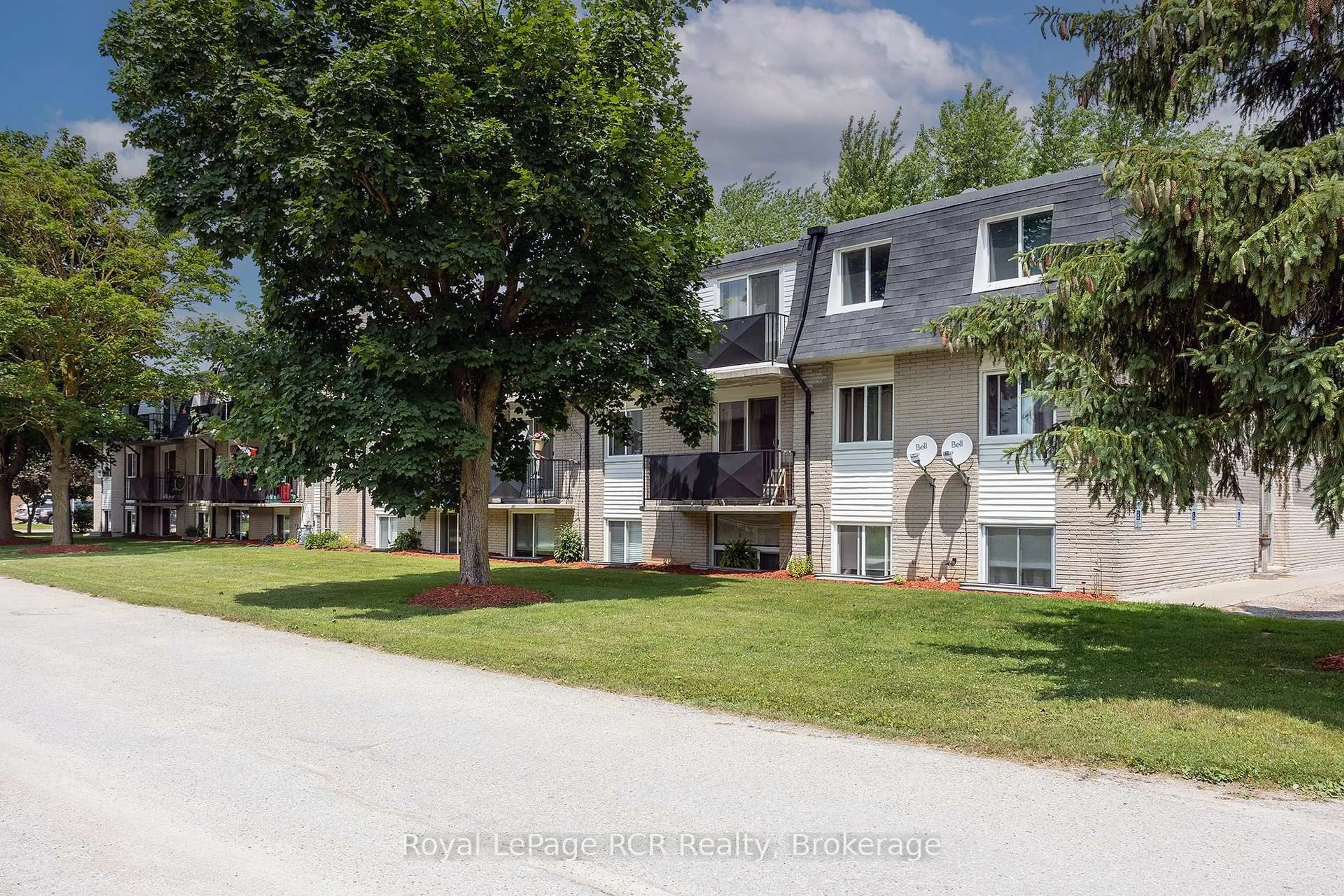 A pic from outside/outdoor area/front of a property/back of a property/a pic from drone, street for 118 Preston St #Unit 102, Wellington North Ontario N0G 1A0