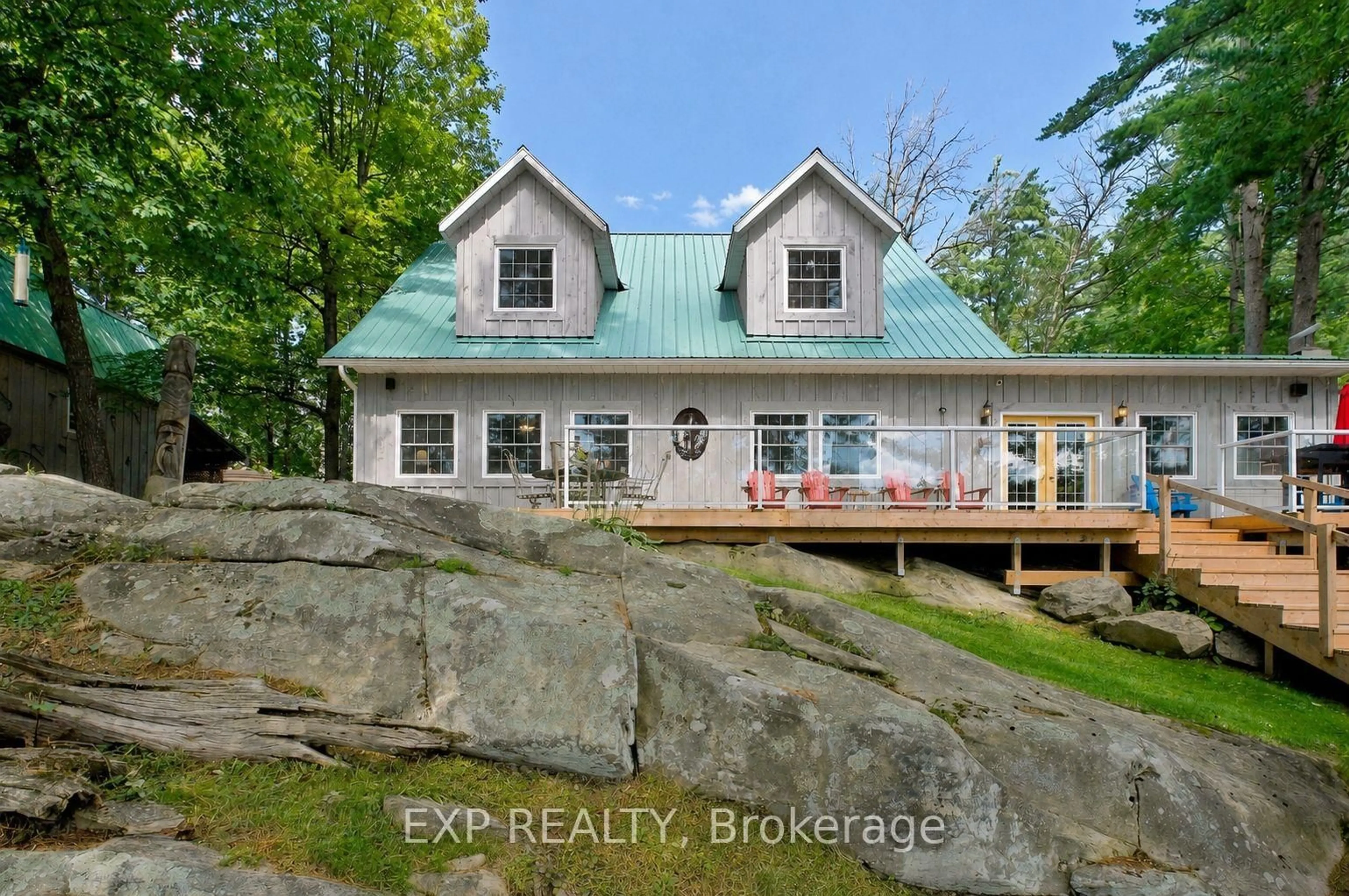 A pic from outside/outdoor area/front of a property/back of a property/a pic from drone, water/lake/river/ocean view for 14 Severn River #SR404, Muskoka Lakes Ontario P0C 1M0