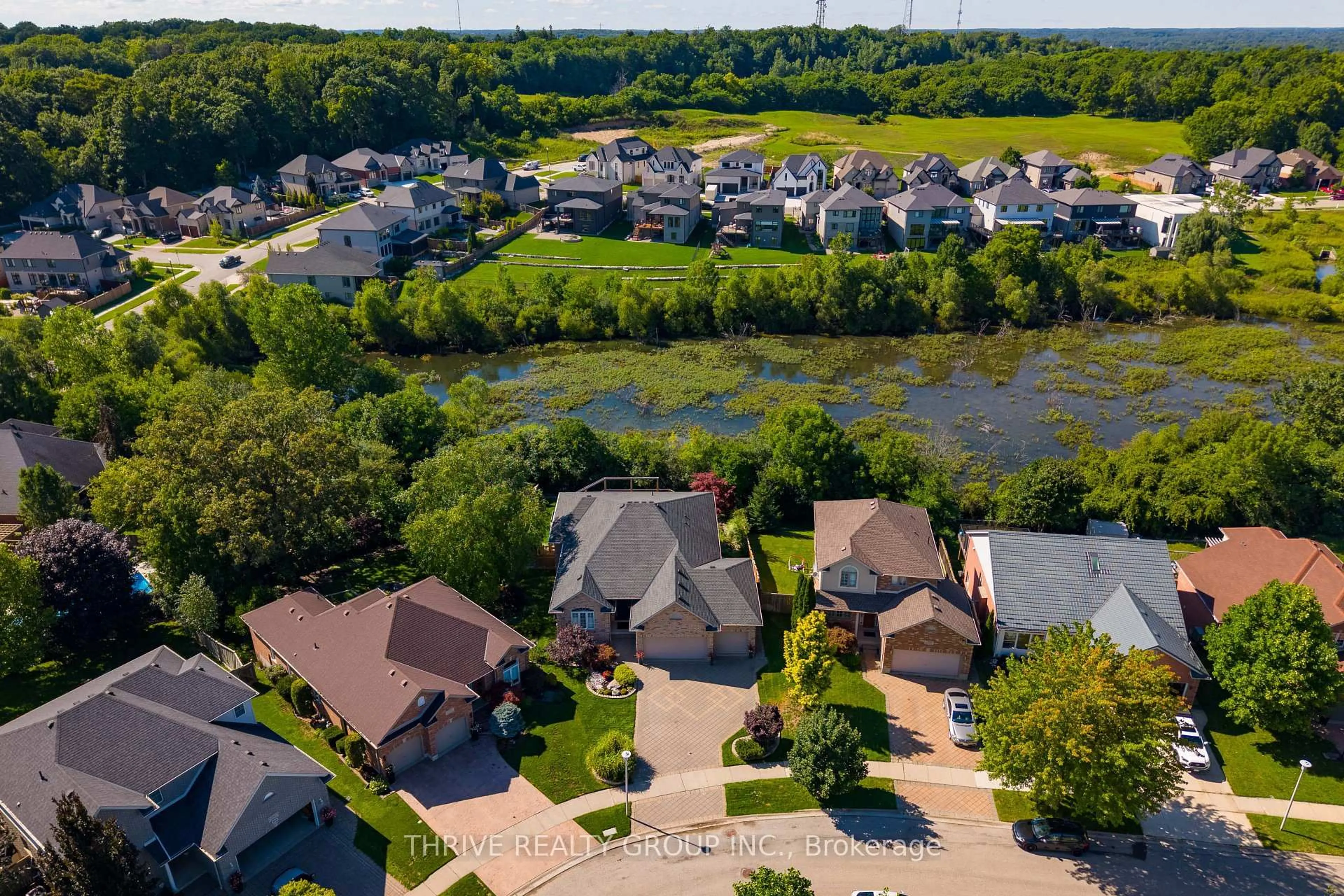 A pic from outside/outdoor area/front of a property/back of a property/a pic from drone, water/lake/river/ocean view for 1193 Thornley St, London South Ontario N6K 4V5