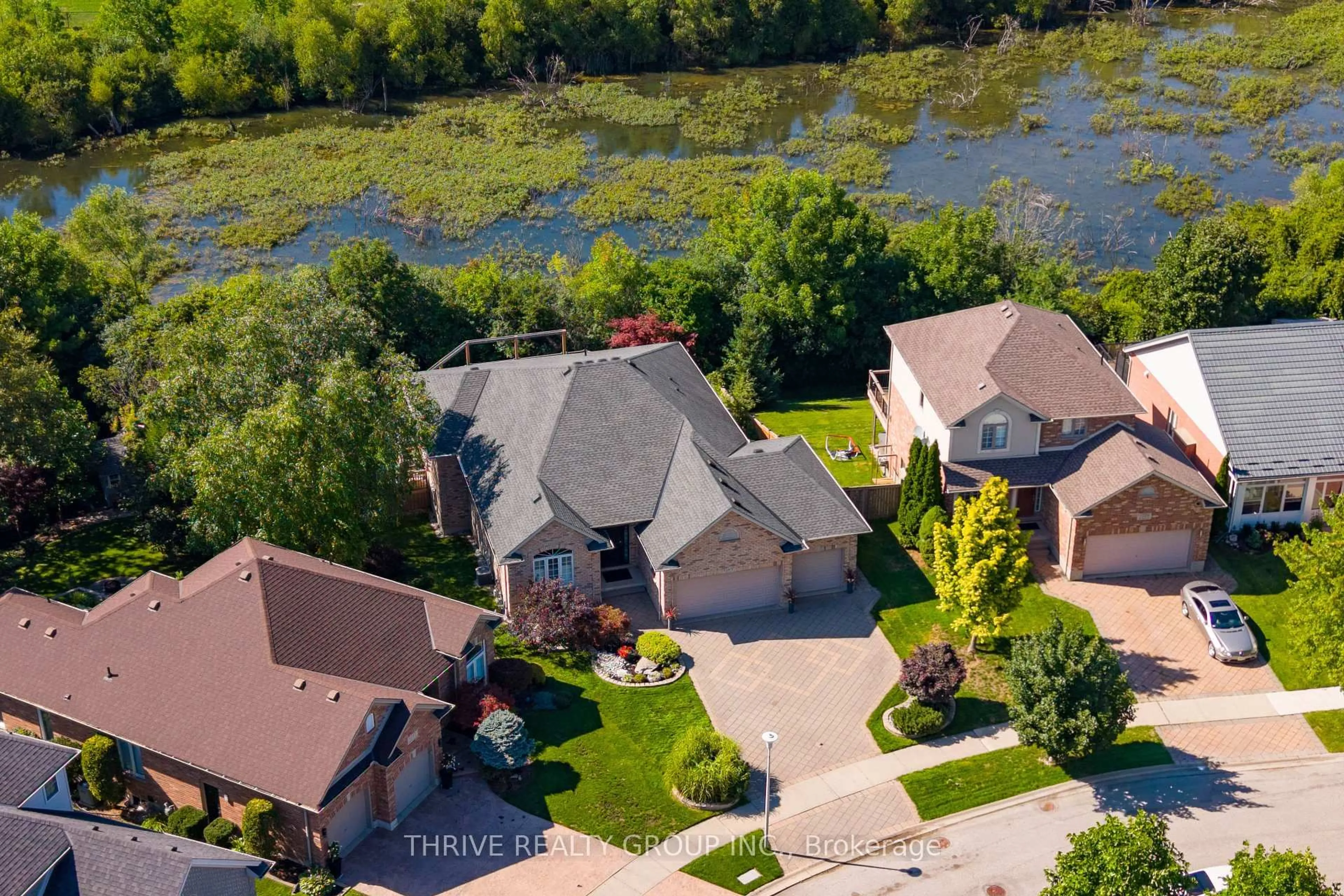 A pic from outside/outdoor area/front of a property/back of a property/a pic from drone, water/lake/river/ocean view for 1193 Thornley St, London South Ontario N6K 4V5