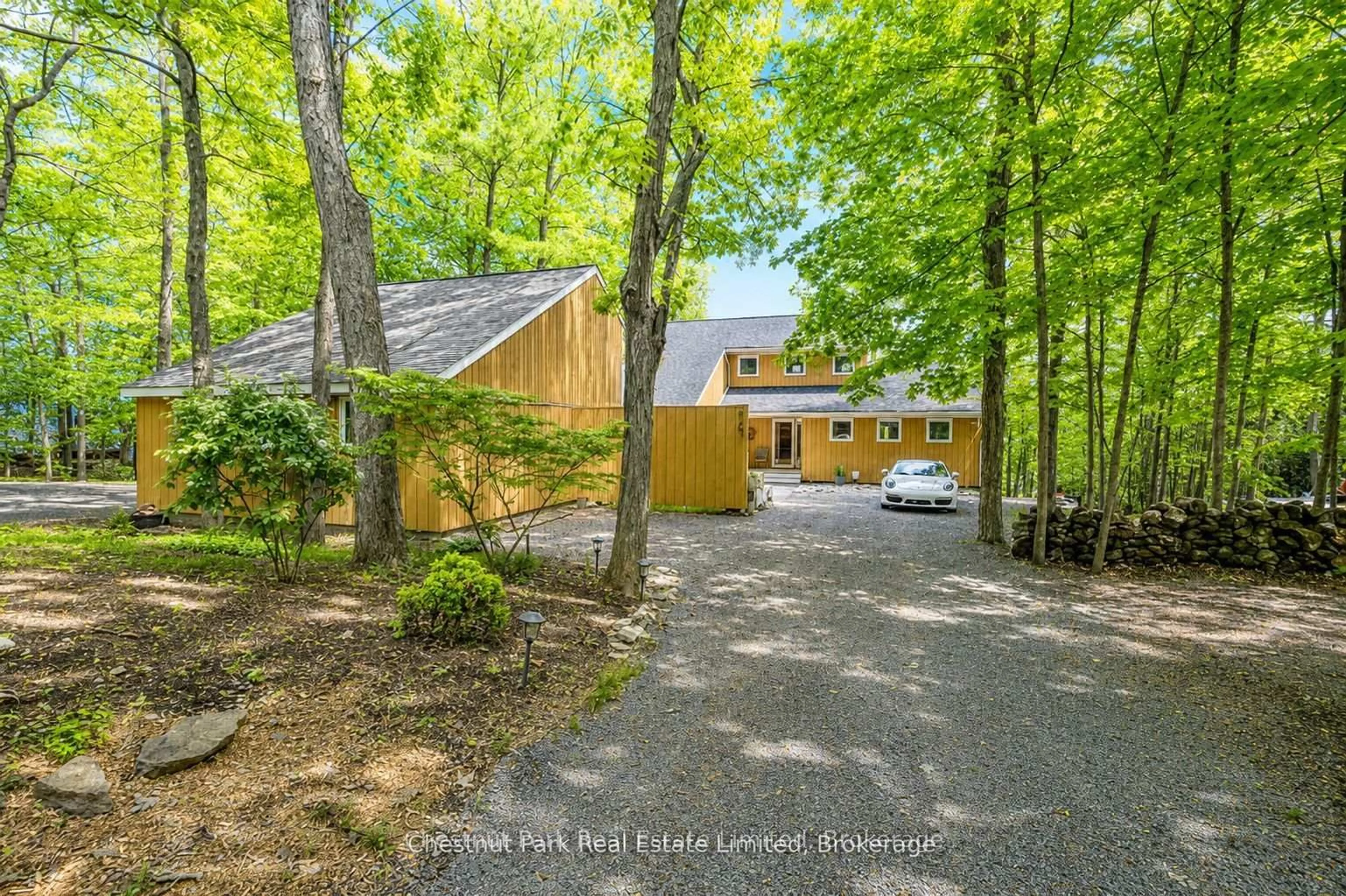 A pic from outside/outdoor area/front of a property/back of a property/a pic from drone, forest/trees view for 347 Prinyers Cove Cres, Prince Edward County Ontario K0K 2T0