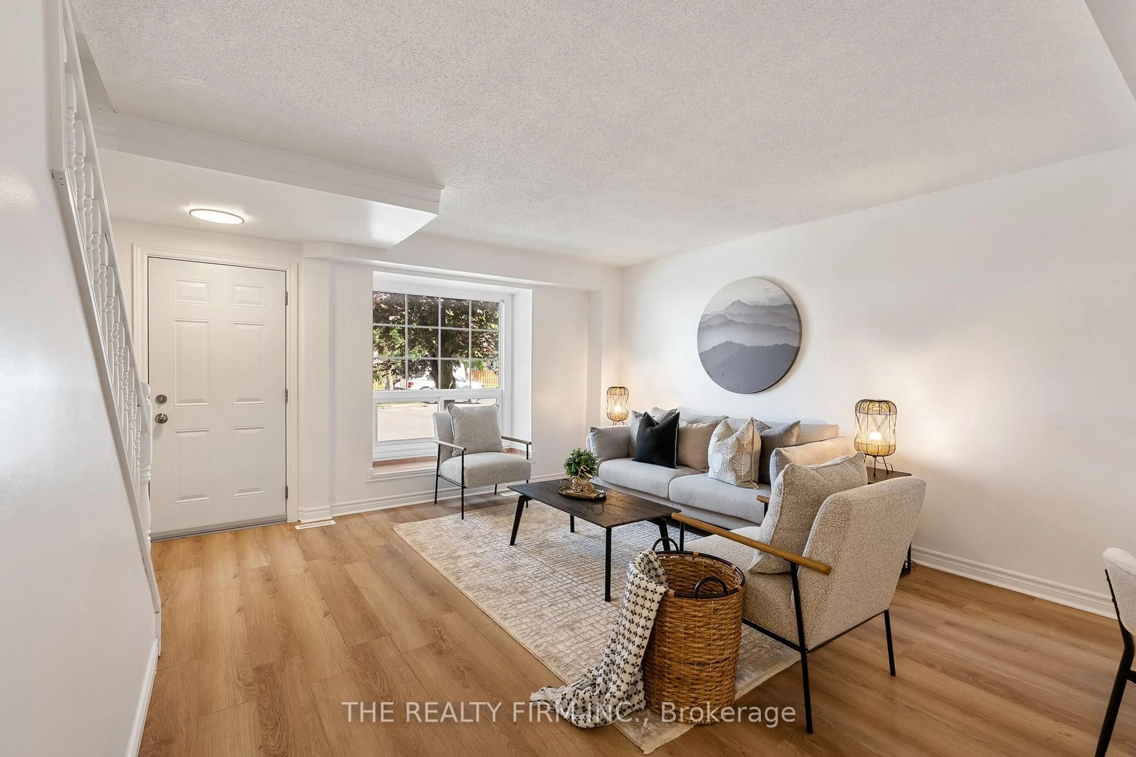 Living room with furniture, wood/laminate floor for 1215 Cheapside St #8, London East Ontario N5Y 5J9