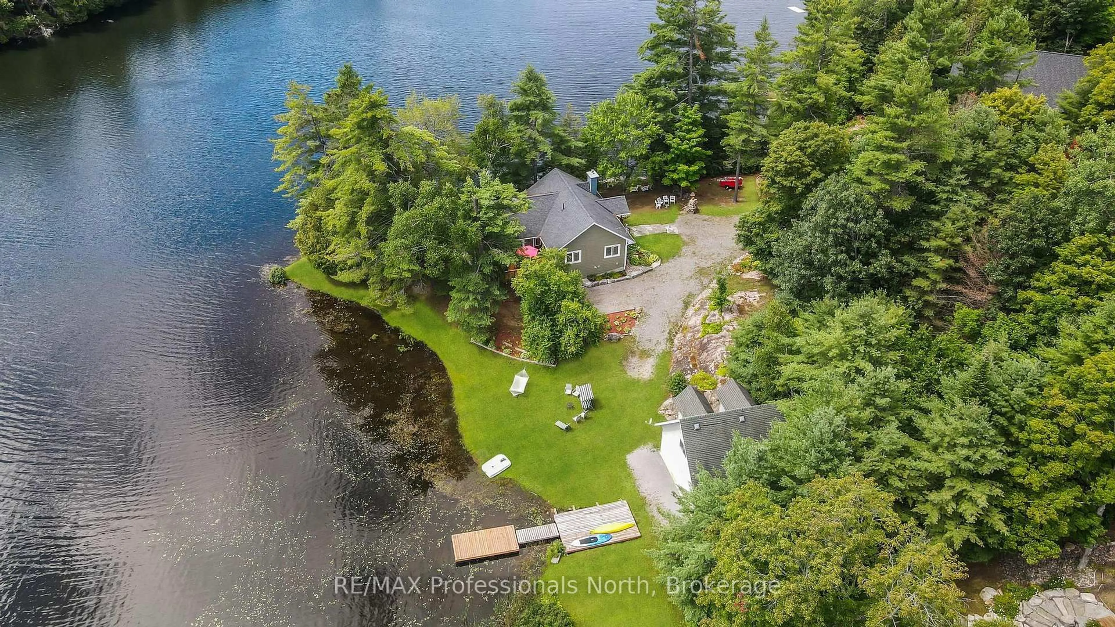 A pic from outside/outdoor area/front of a property/back of a property/a pic from drone, water/lake/river/ocean view for 1029 Trio Lane, Highlands East Ontario K0M 1R0