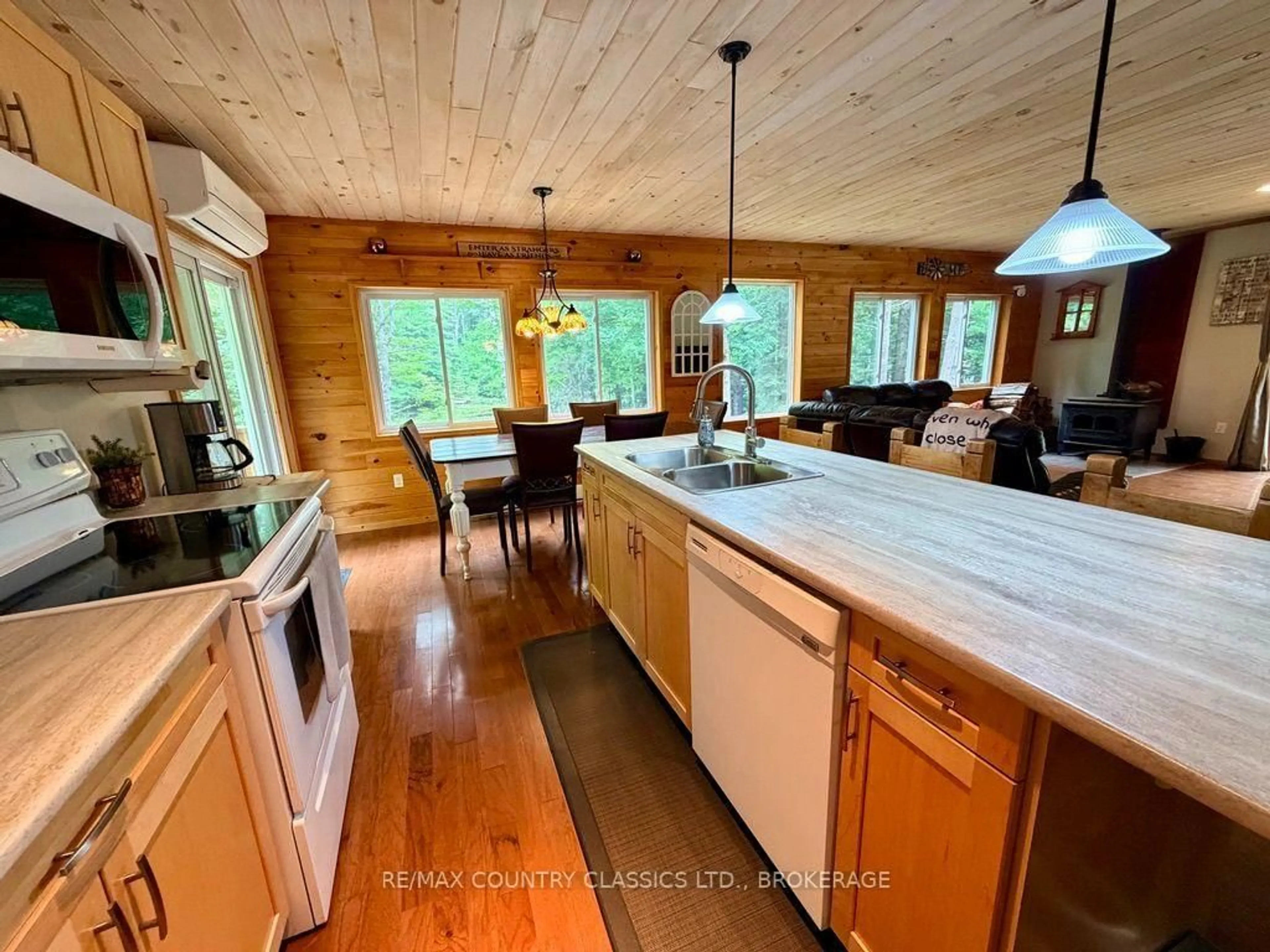 Open concept kitchen, wood/laminate floor for 1068C Jacques Bay Rd, Cloyne Ontario K0H 1K0