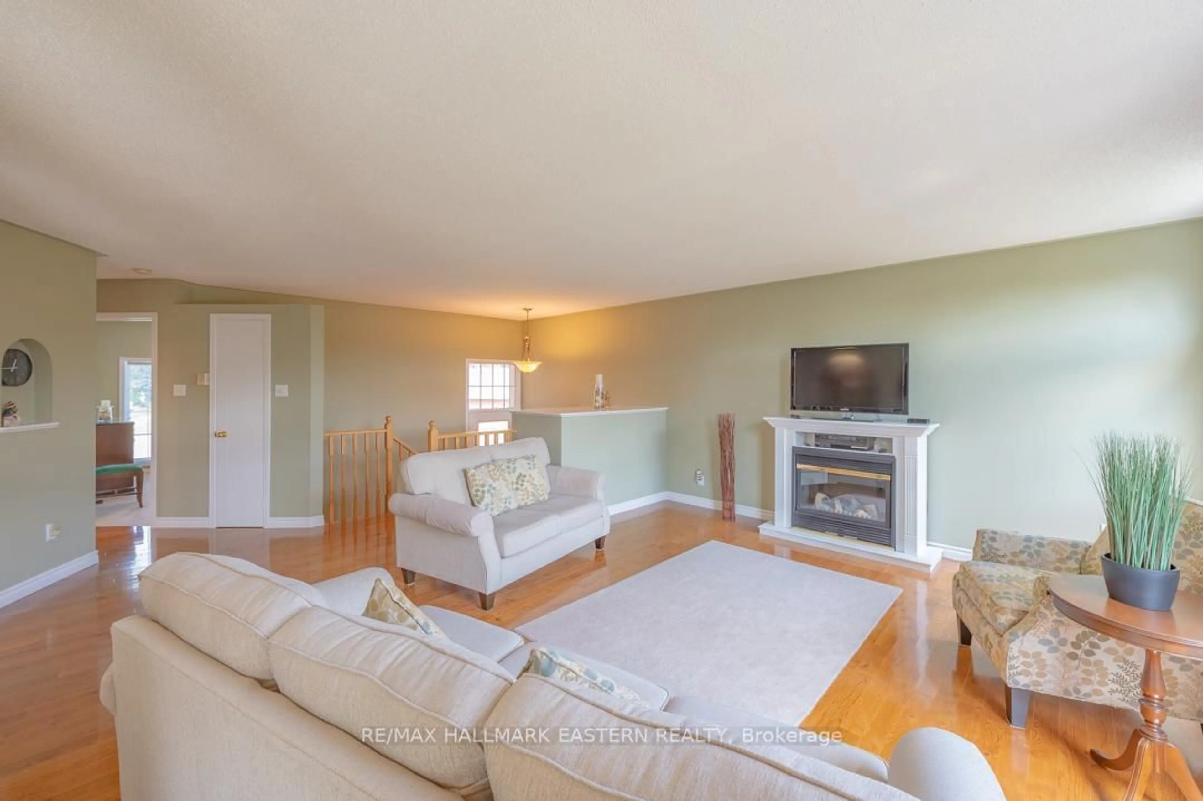 Living room with furniture, wood/laminate floor for 20 Ferguson Pl, Peterborough Ontario K9H 7M9