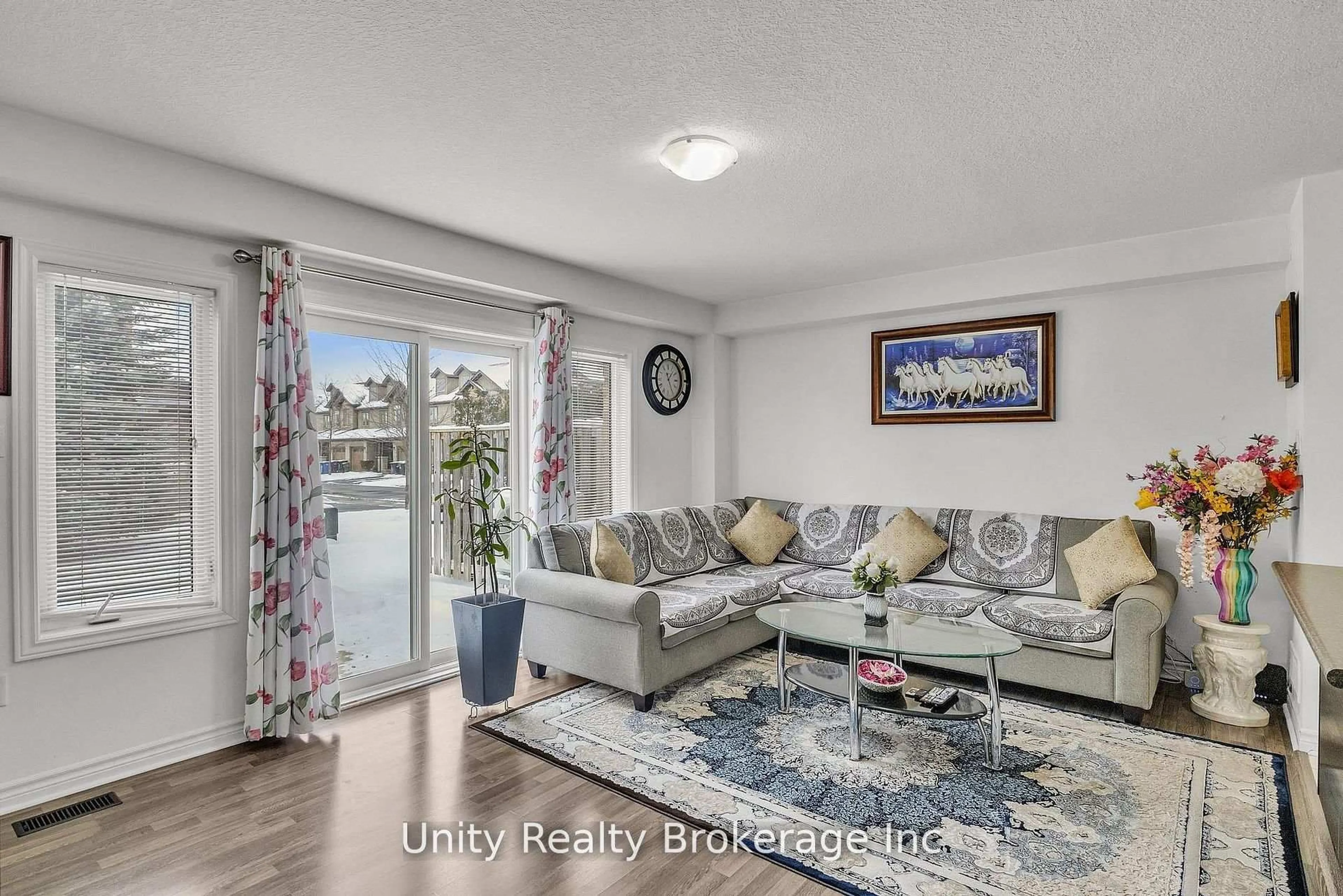Living room with furniture, wood/laminate floor for 44 Arlington Cres, Guelph Ontario N1L 0K9