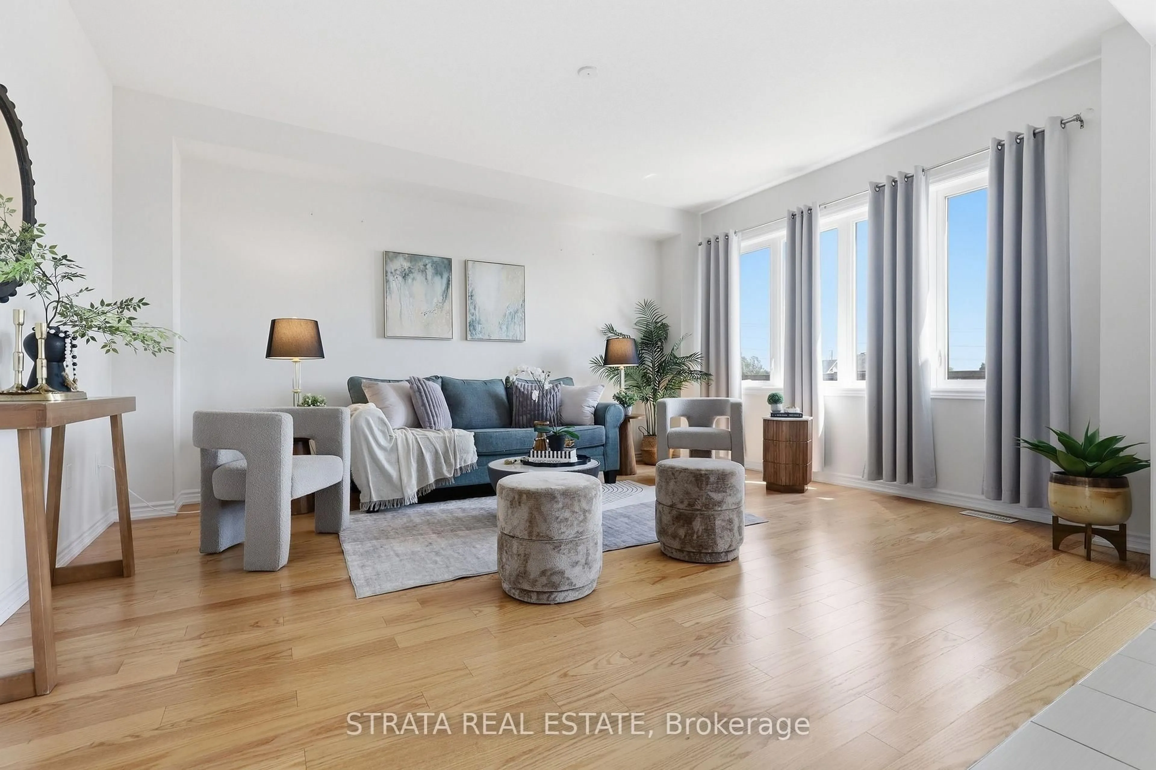 Living room with furniture, wood/laminate floor for 182 Explorer Way, Thorold Ontario L2V 0K3