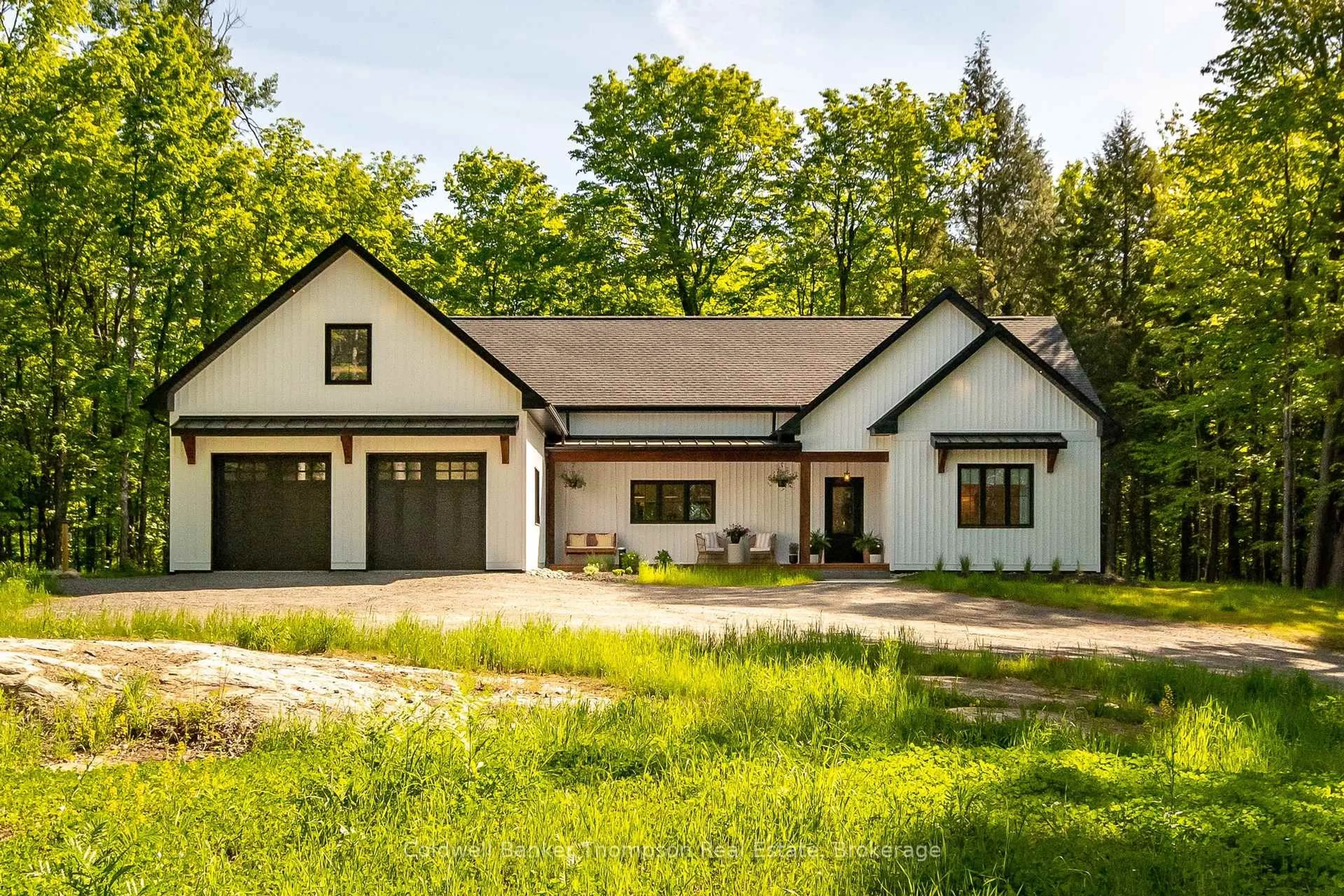 Home with vinyl exterior material, street for 960 Brunel Rd, Huntsville Ontario P1H 2J3
