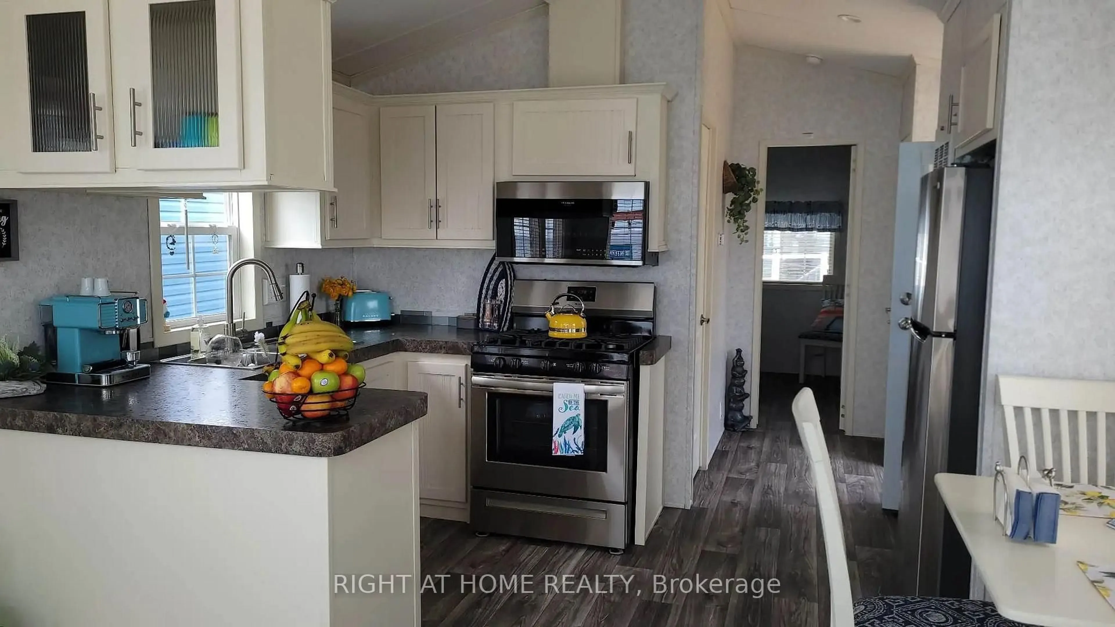 Open concept kitchen, wood/laminate floor for 22499 Gray Line, West Elgin Ontario N0L 2C0