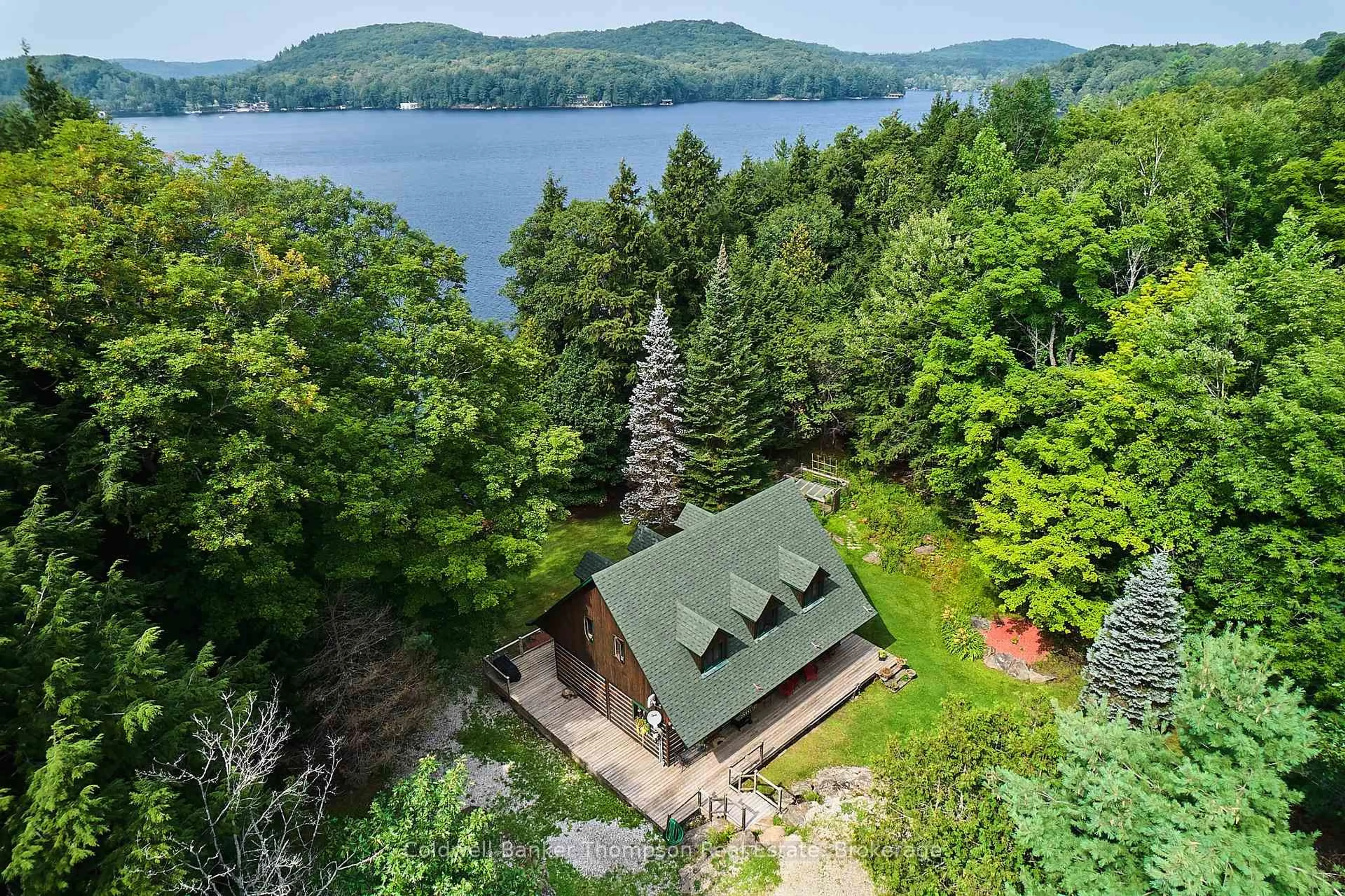 A pic from outside/outdoor area/front of a property/back of a property/a pic from drone, water/lake/river/ocean view for 1028 Clarks Dr, Lake of Bays Ontario P0A 1H0