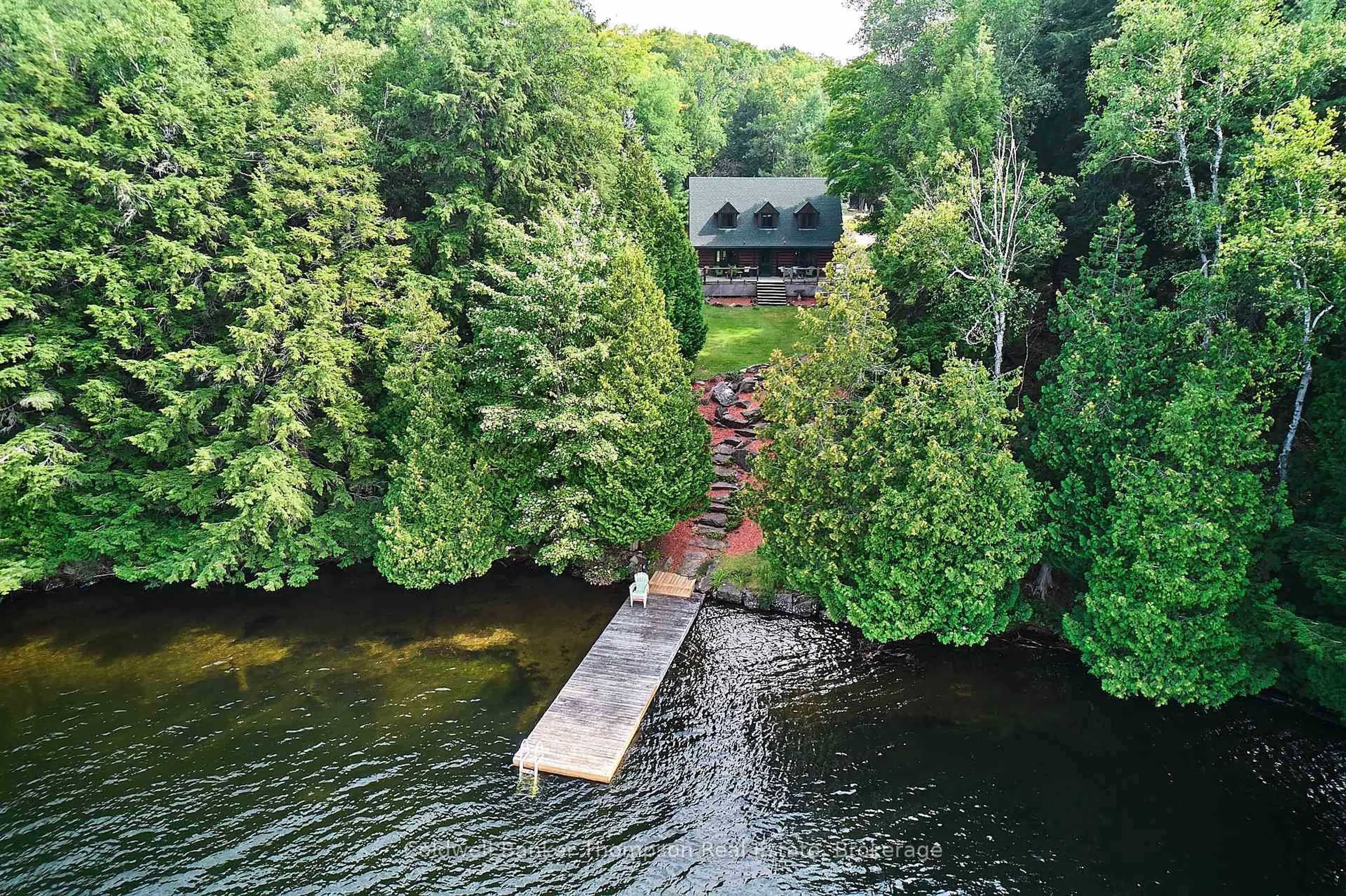 A pic from outside/outdoor area/front of a property/back of a property/a pic from drone, water/lake/river/ocean view for 1028 Clarks Dr, Lake of Bays Ontario P0A 1H0