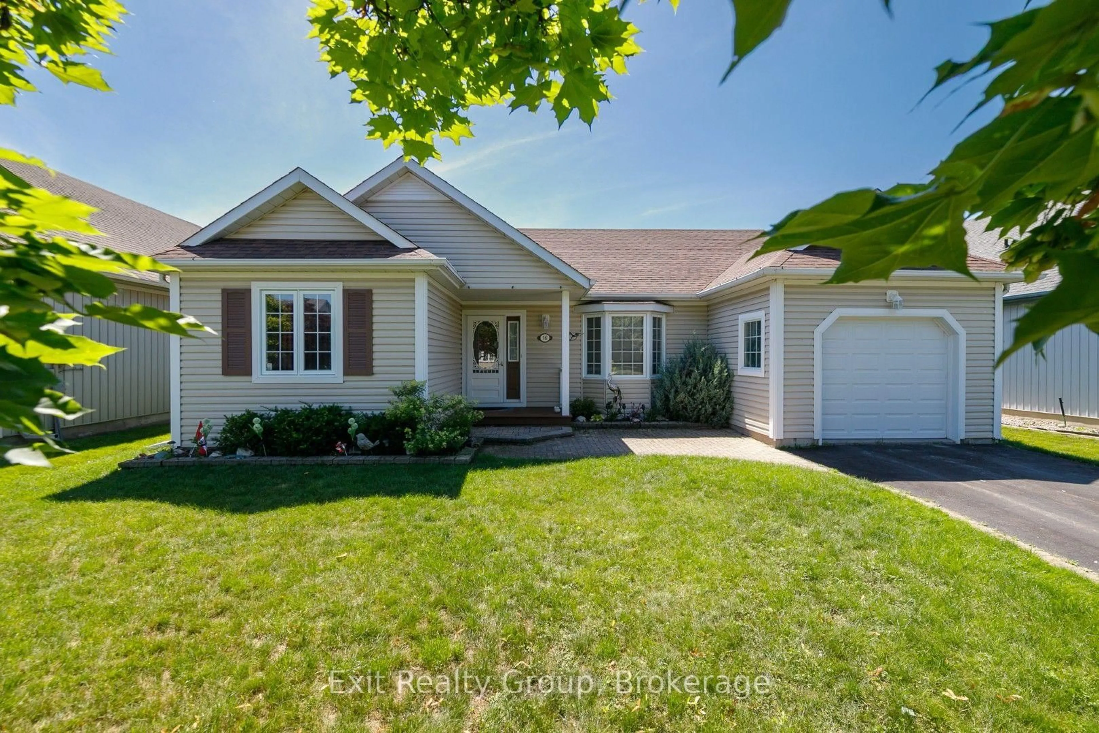 Home with vinyl exterior material, street for 16 Mills Rd, Brighton Ontario K0K 1H0