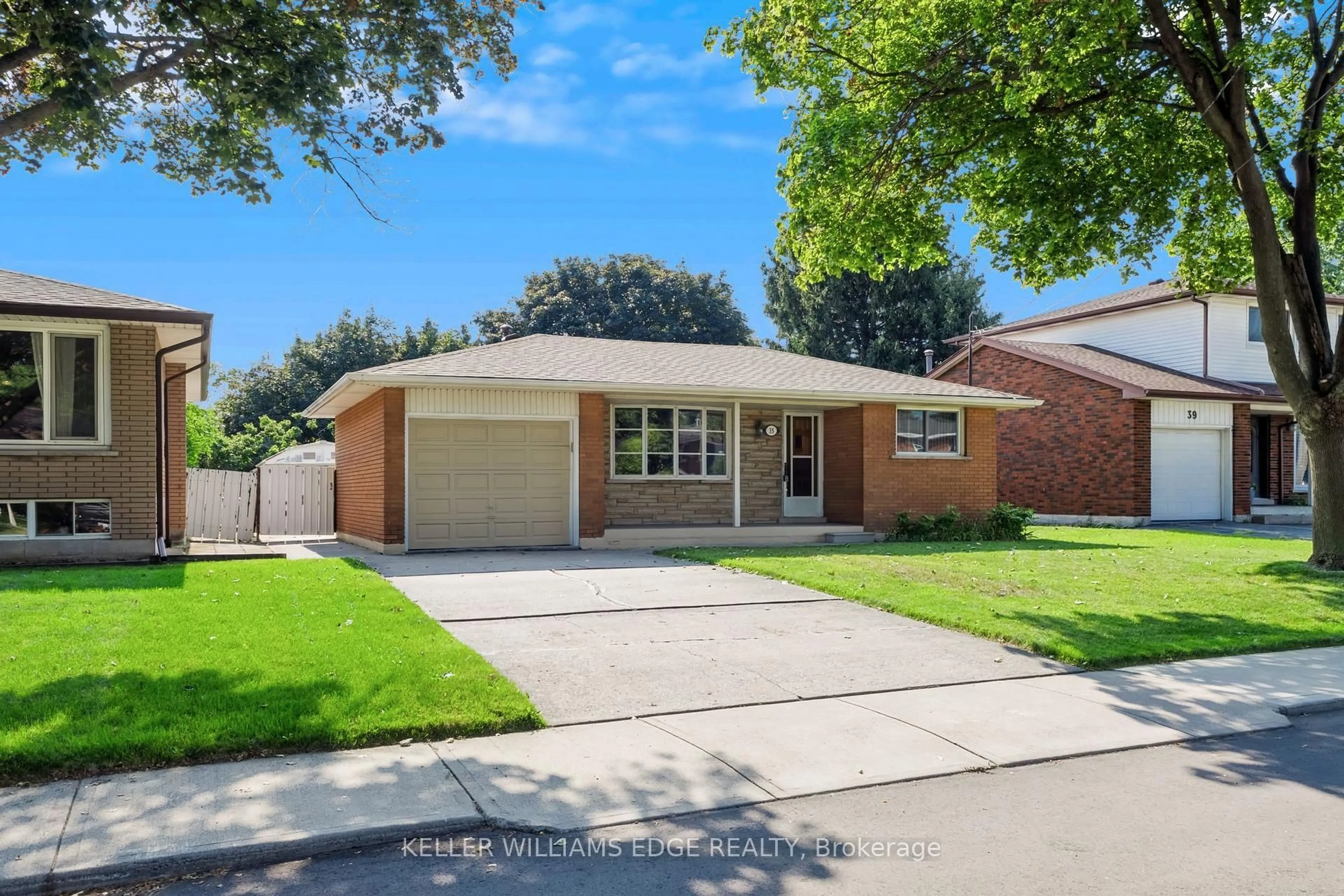 Home with brick exterior material, street for 35 Burrwood Dr, Hamilton Ontario L9C 3S9