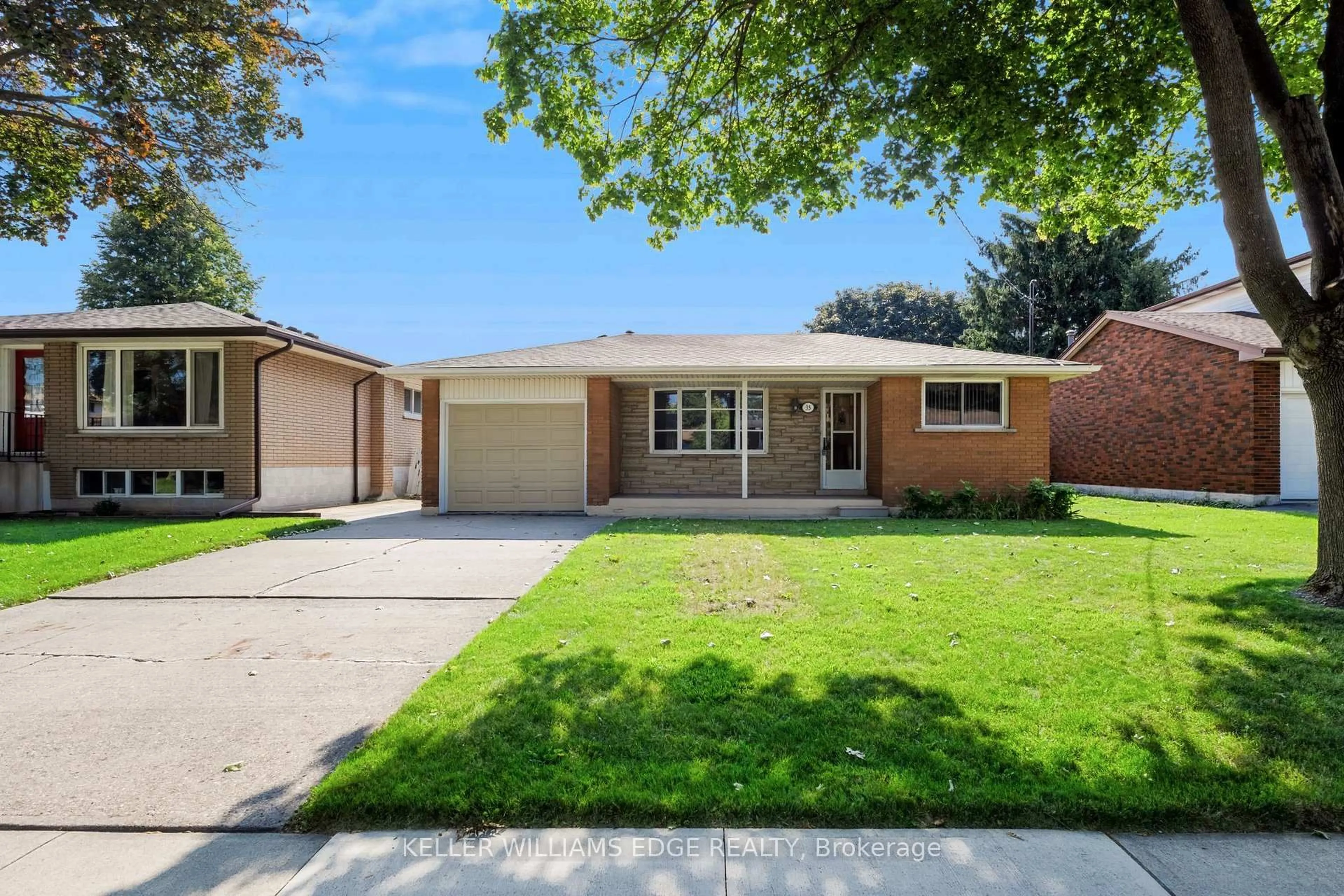 Home with brick exterior material, street for 35 Burrwood Dr, Hamilton Ontario L9C 3S9