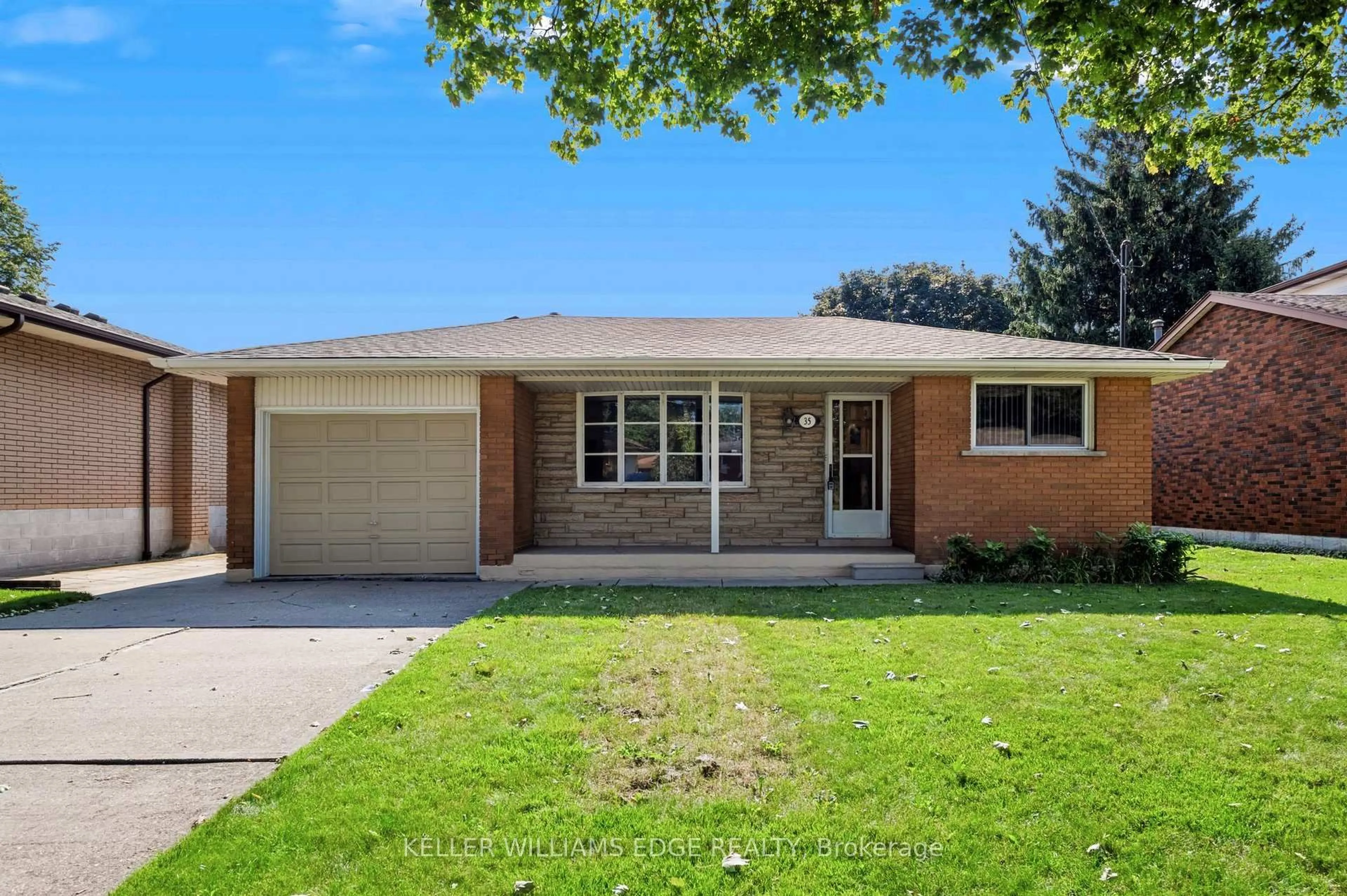 Home with brick exterior material, street for 35 Burrwood Dr, Hamilton Ontario L9C 3S9