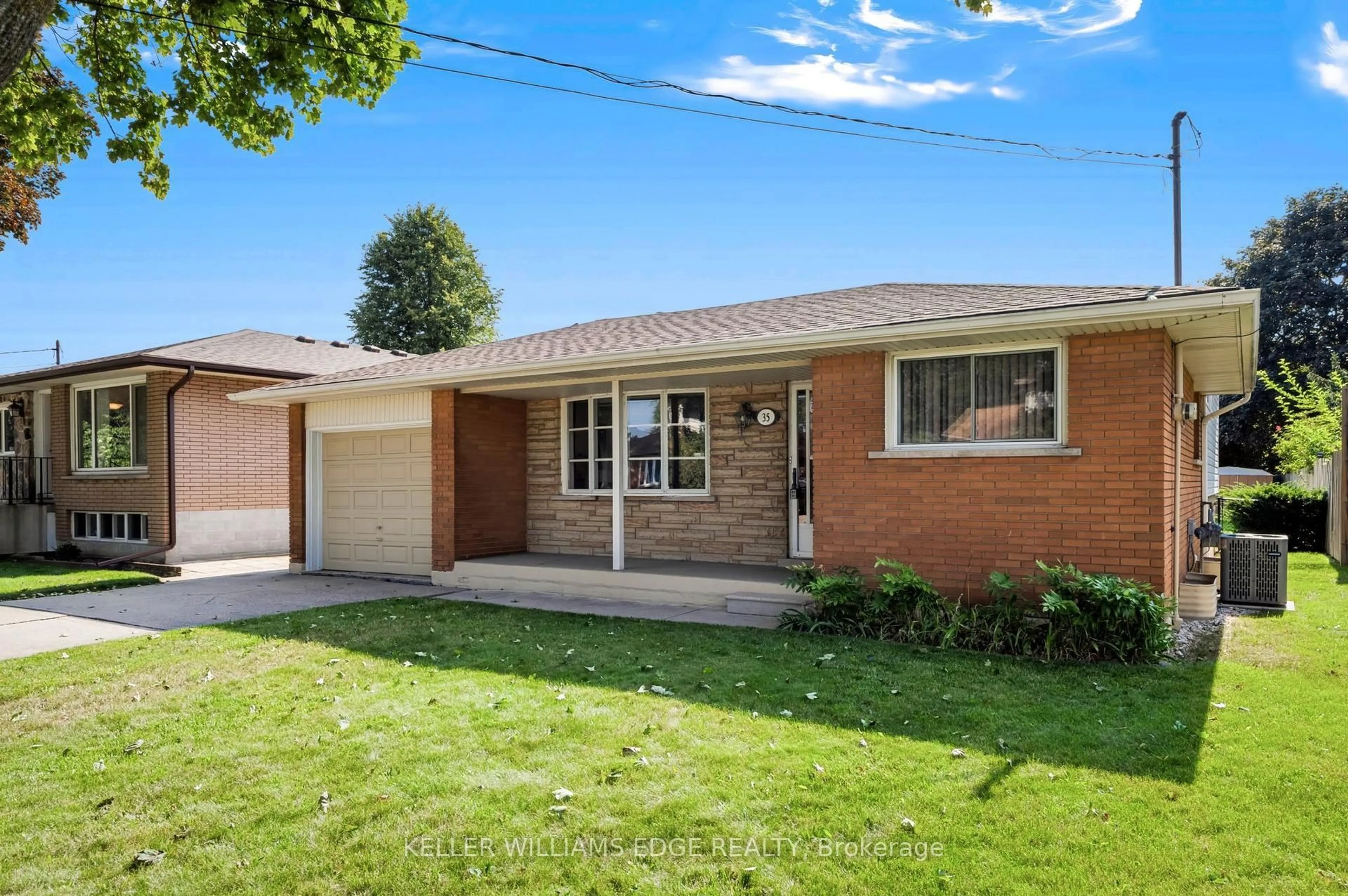 Home with brick exterior material, street for 35 Burrwood Dr, Hamilton Ontario L9C 3S9
