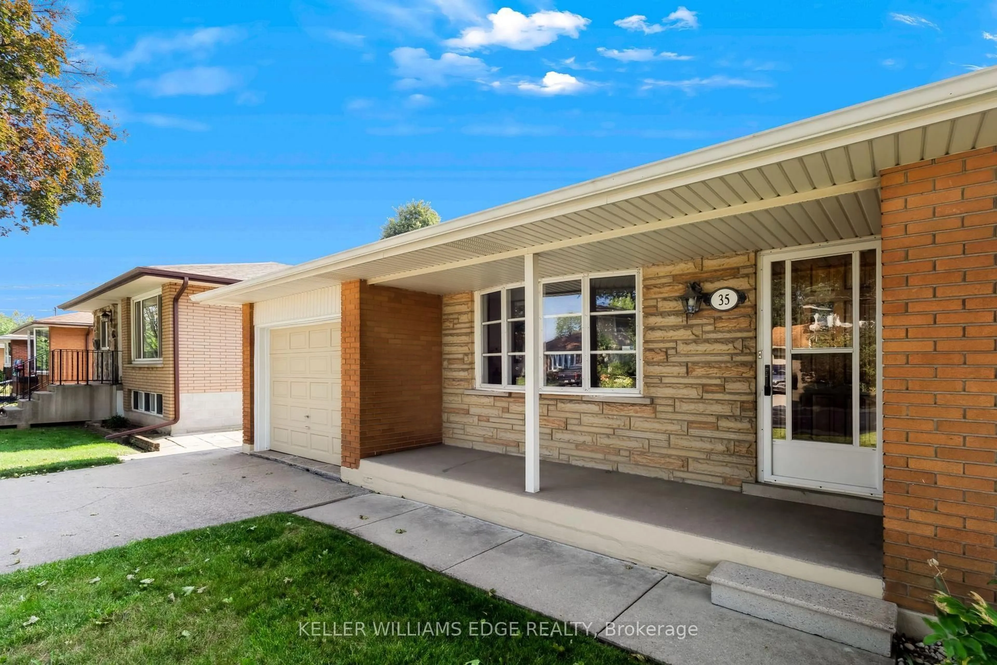Home with brick exterior material, street for 35 Burrwood Dr, Hamilton Ontario L9C 3S9