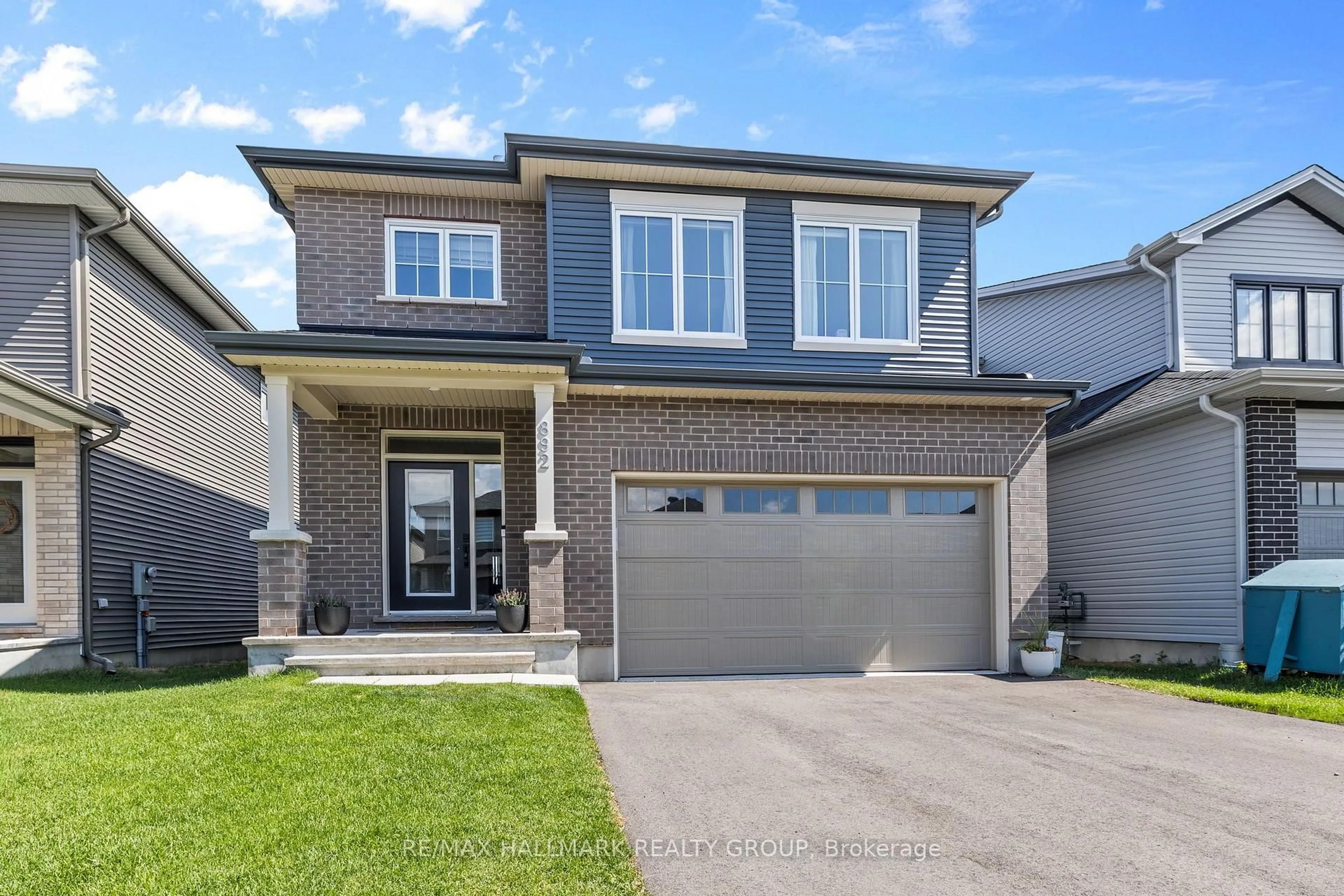 Home with brick exterior material, street for 892 Sendero Way, Stittsville Ontario K2S 2W8