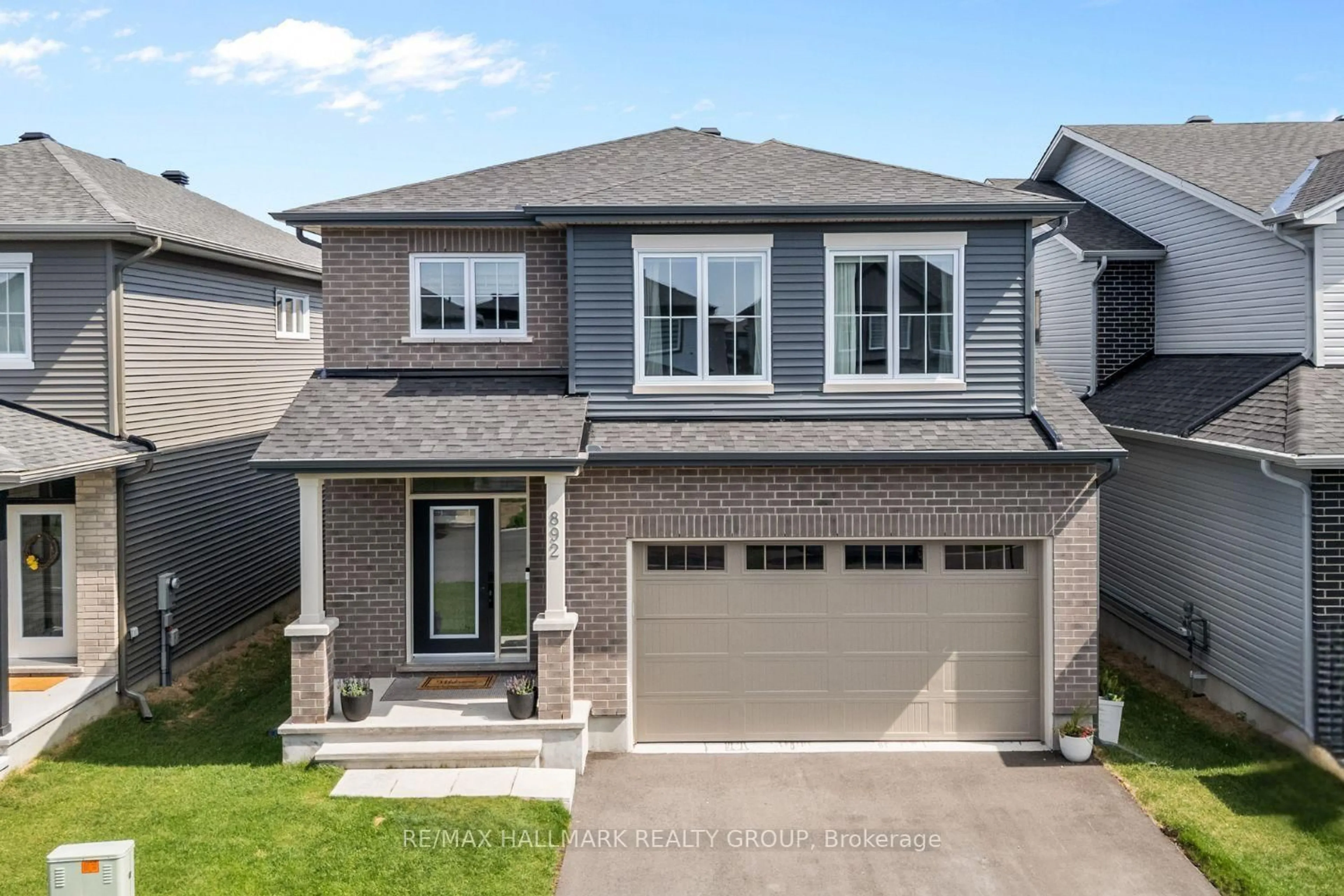 Home with brick exterior material, street for 892 Sendero Way, Stittsville Ontario K2S 2W8