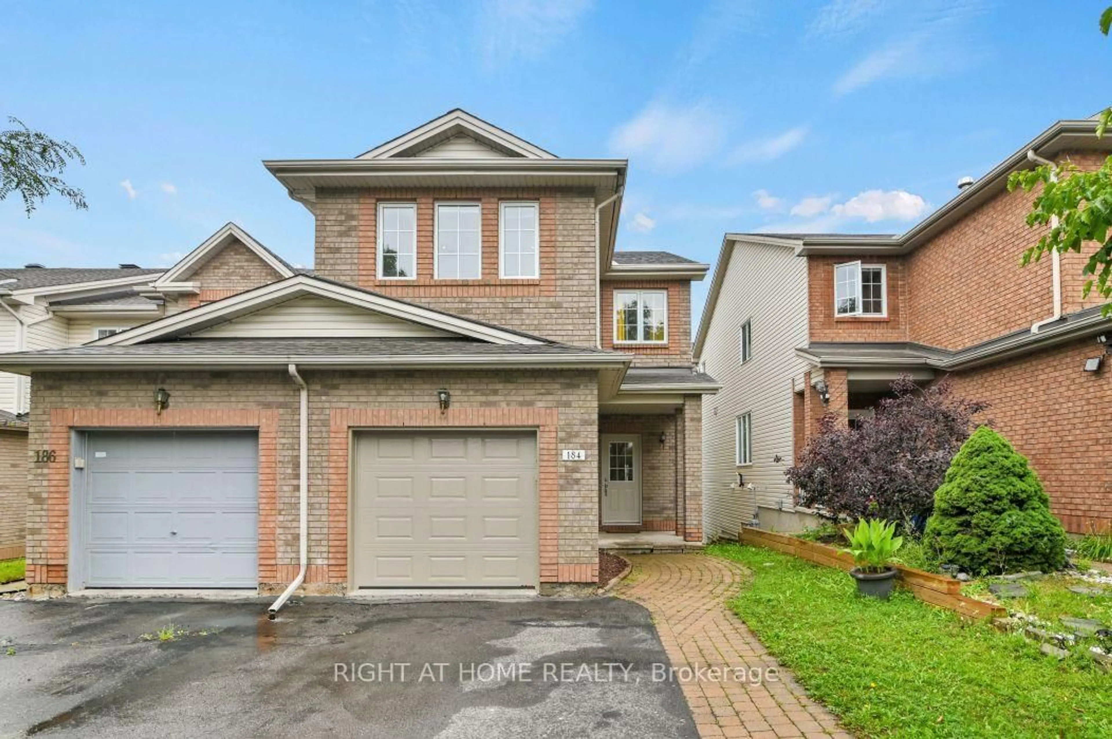 Home with brick exterior material, street for 184 Carwood Circ, Ottawa Ontario K1K 4V4