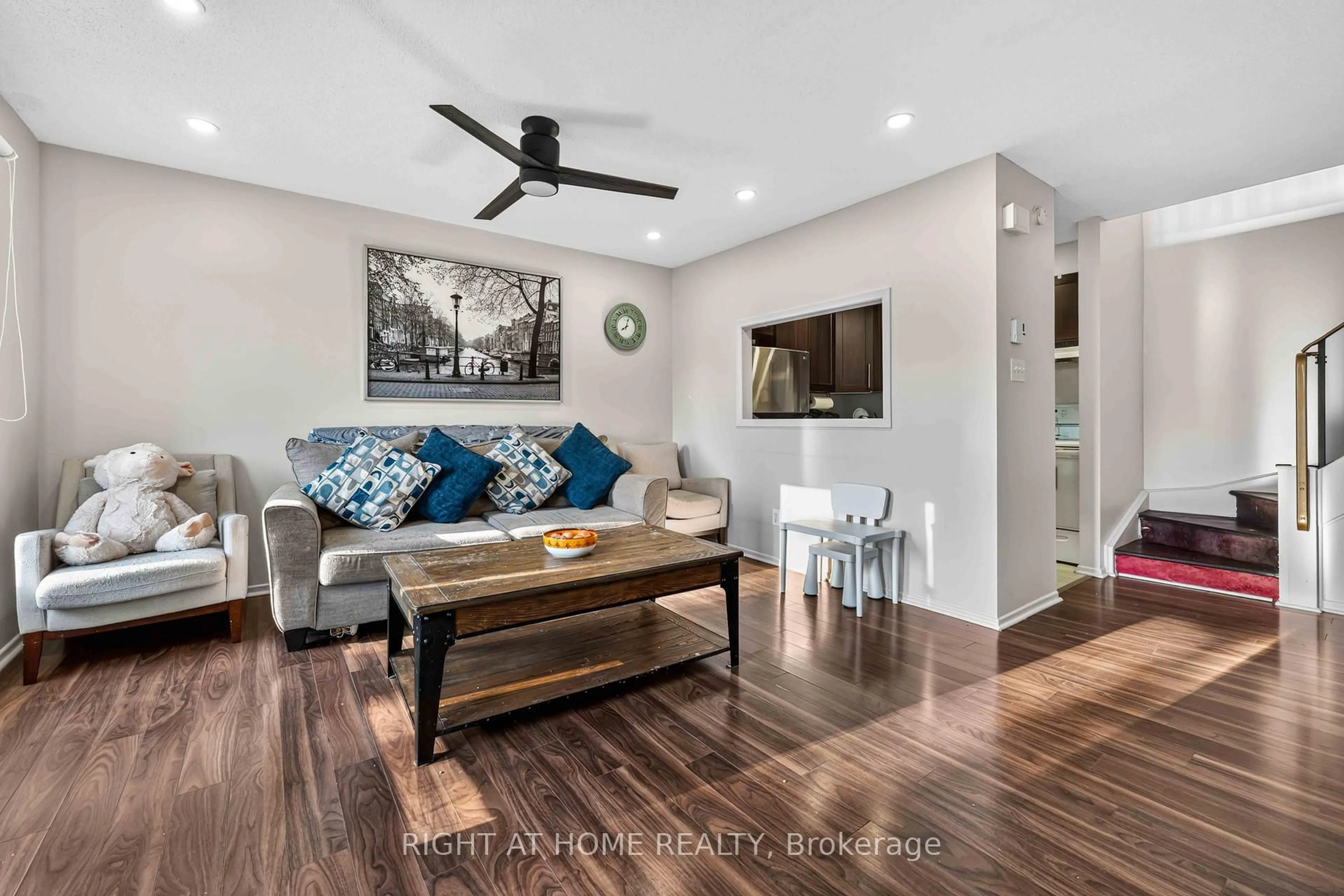 Living room with furniture, wood/laminate floor for 13 BANNER Rd #C, Ottawa Ontario K2H 8T3