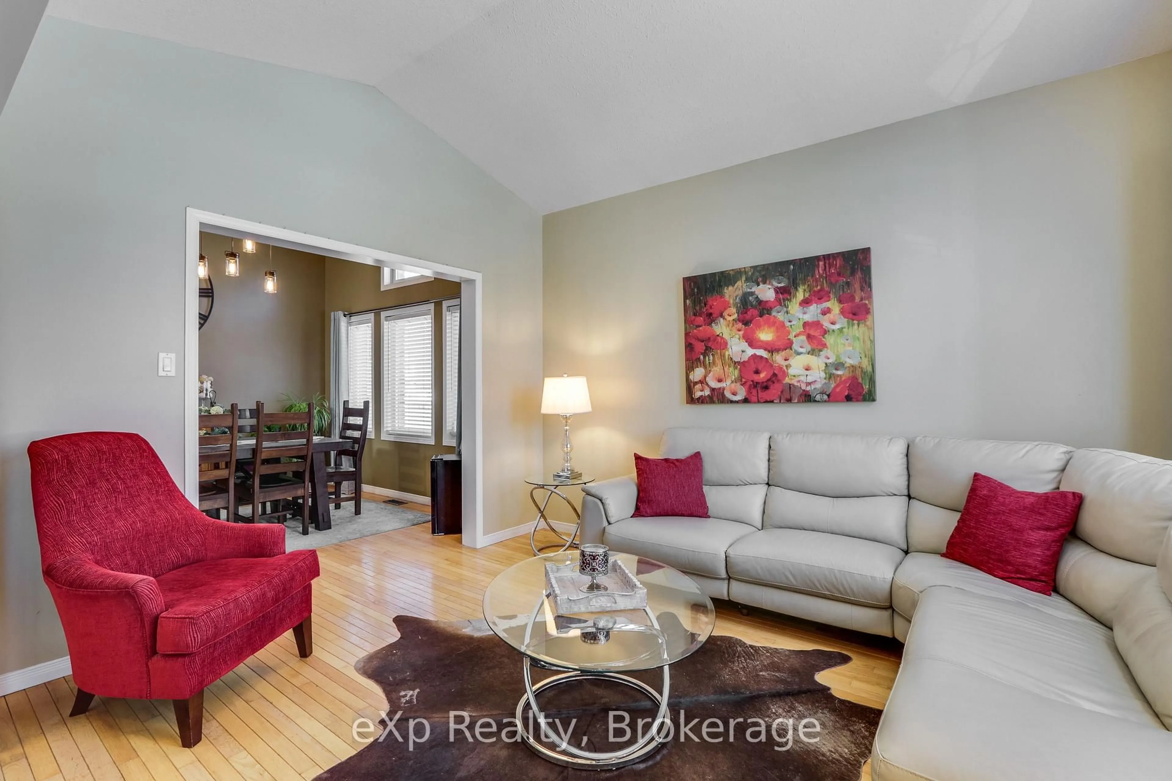 Living room with furniture, wood/laminate floor for 547 Forest Creek Pl, London East Ontario N5Y 5T7