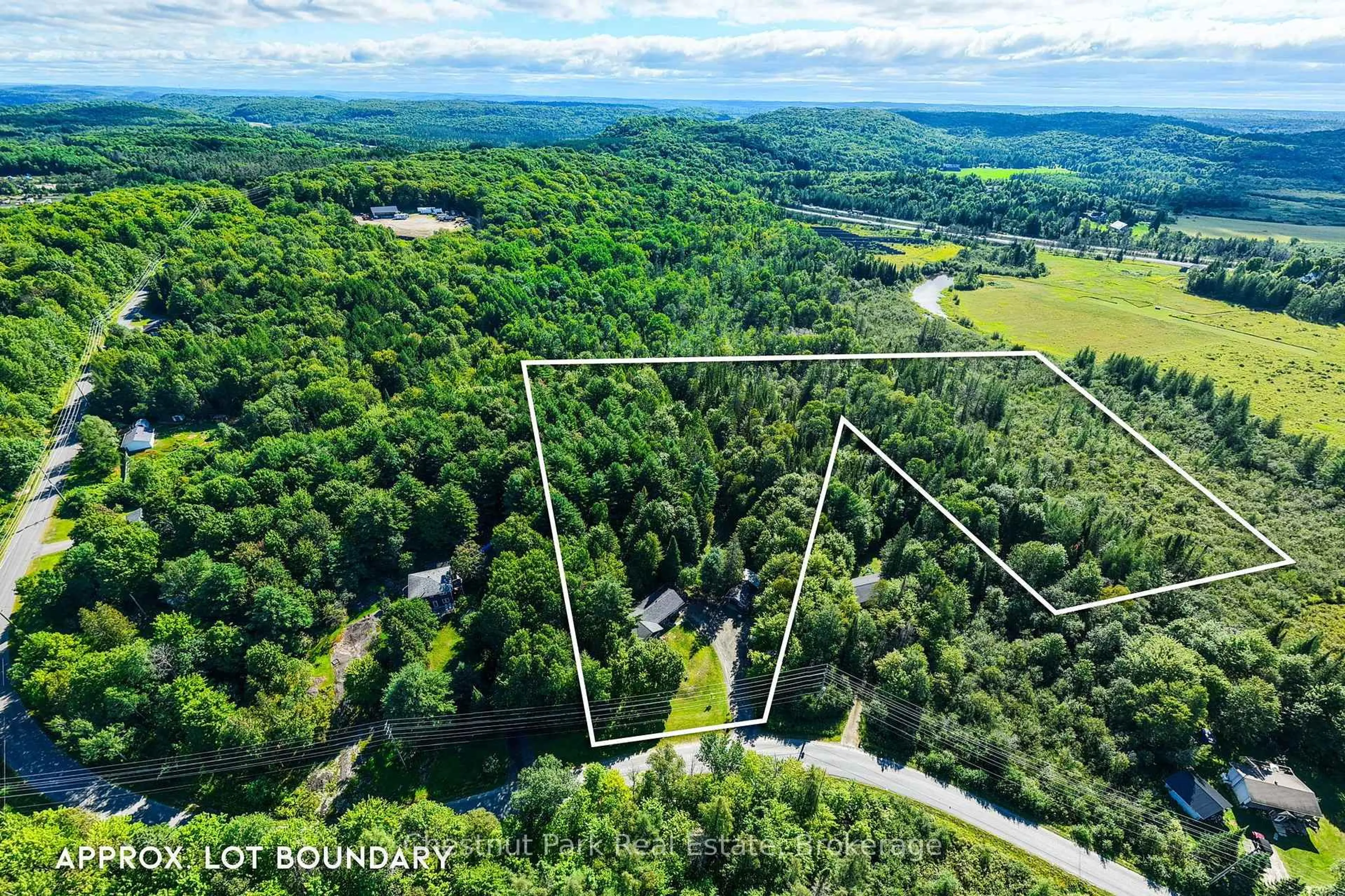 A pic from outside/outdoor area/front of a property/back of a property/a pic from drone, forest/trees view for 521 Old Muskoka Rd, Huntsville Ontario P1H 0G8