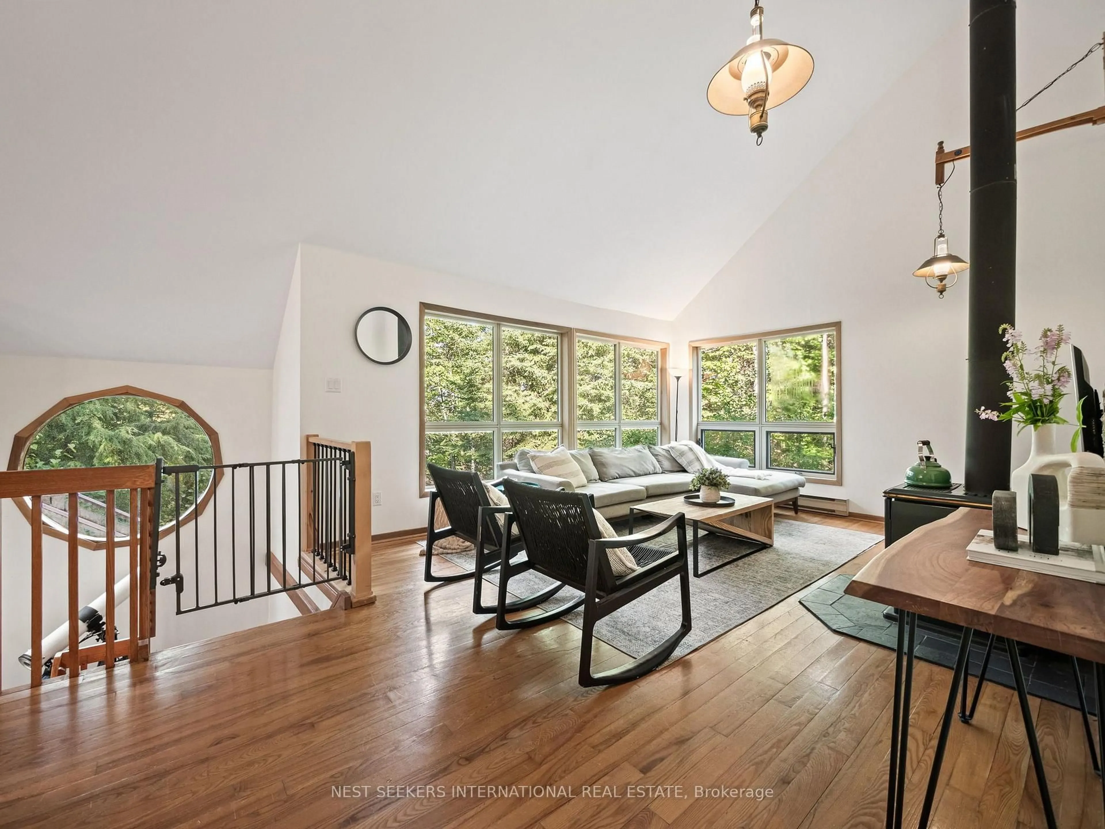 Living room with furniture, wood/laminate floor for 1059 Norwalk Rd, Highlands East Ontario K0L 3C0