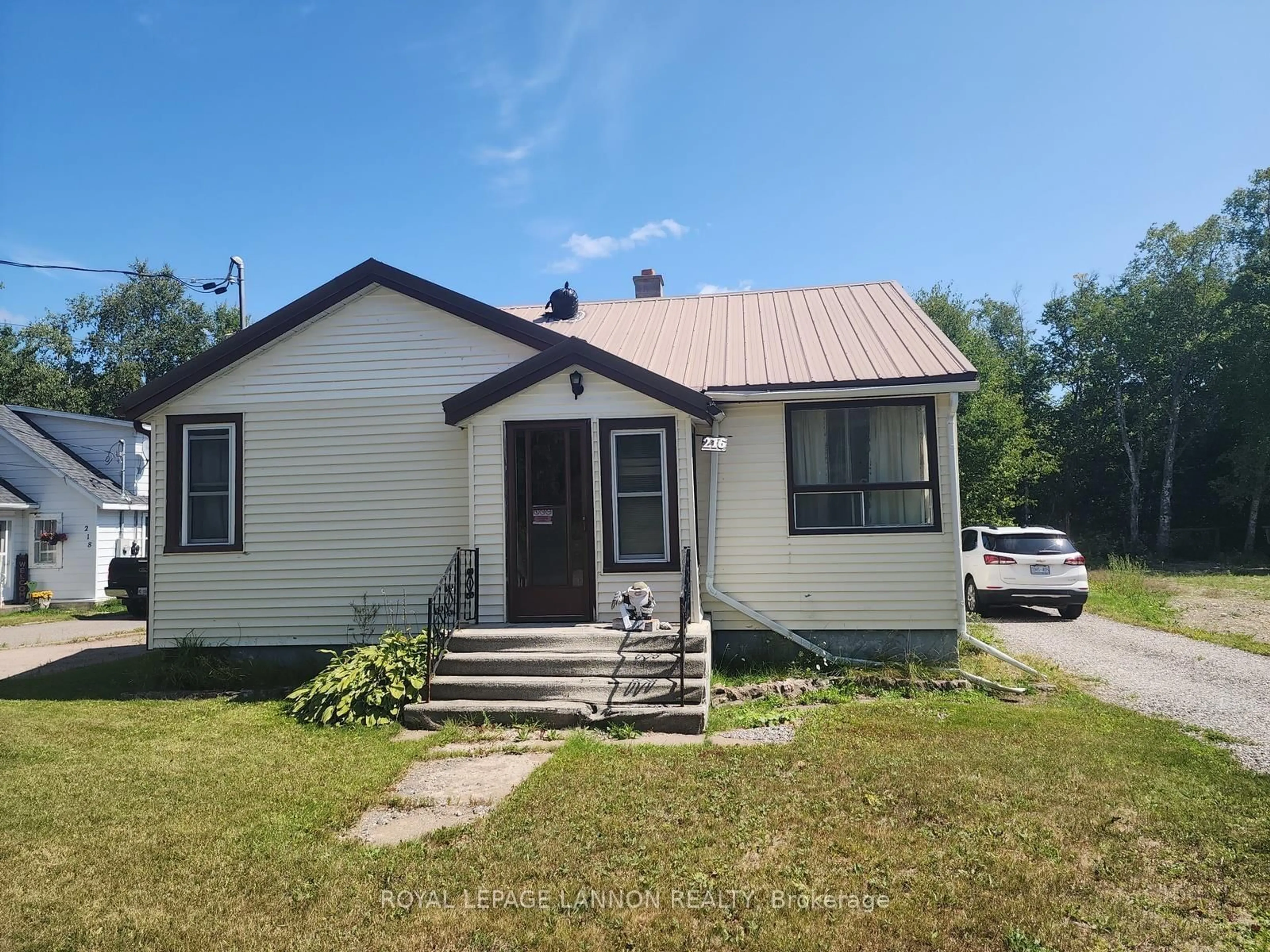 Home with vinyl exterior material, street for 216 MAIN, Schreiber Ontario P0T 2S0