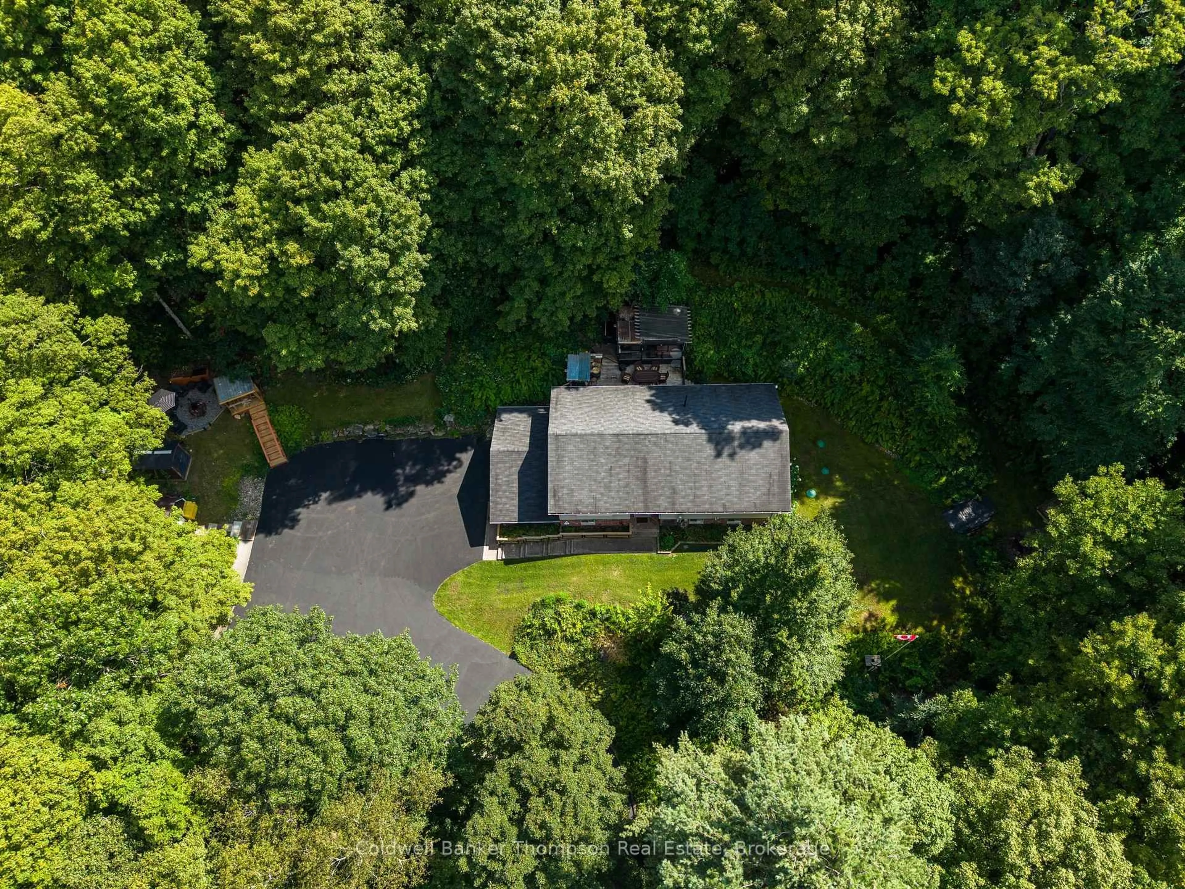 A pic from outside/outdoor area/front of a property/back of a property/a pic from drone, forest/trees view for 935 Aspdin Rd, Huntsville Ontario P1H 2J2